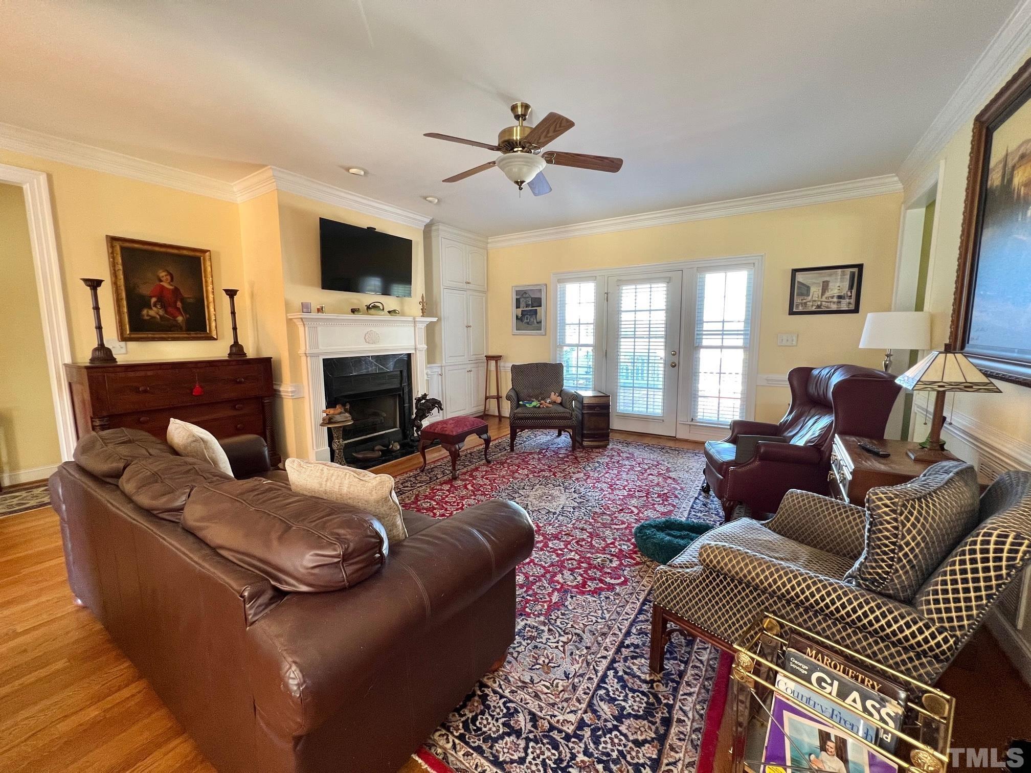 8666 Bailey Road Sims, NC 27880 - Photo 21 of 35 a living room with furniture fireplace and a flat screen tv