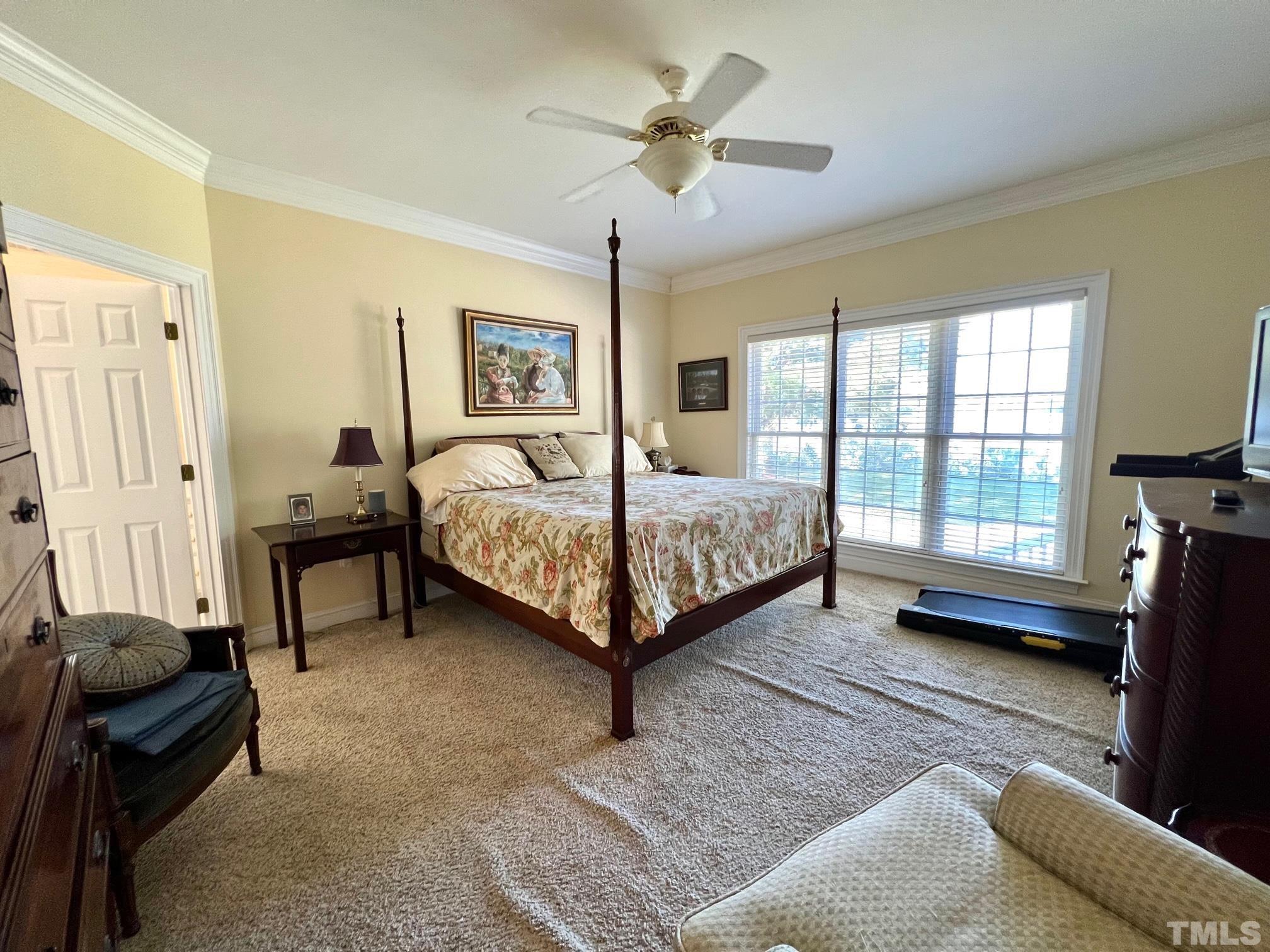 8666 Bailey Road Sims, NC 27880 - Photo 27 of 35 a bedroom with a bed couch and a window