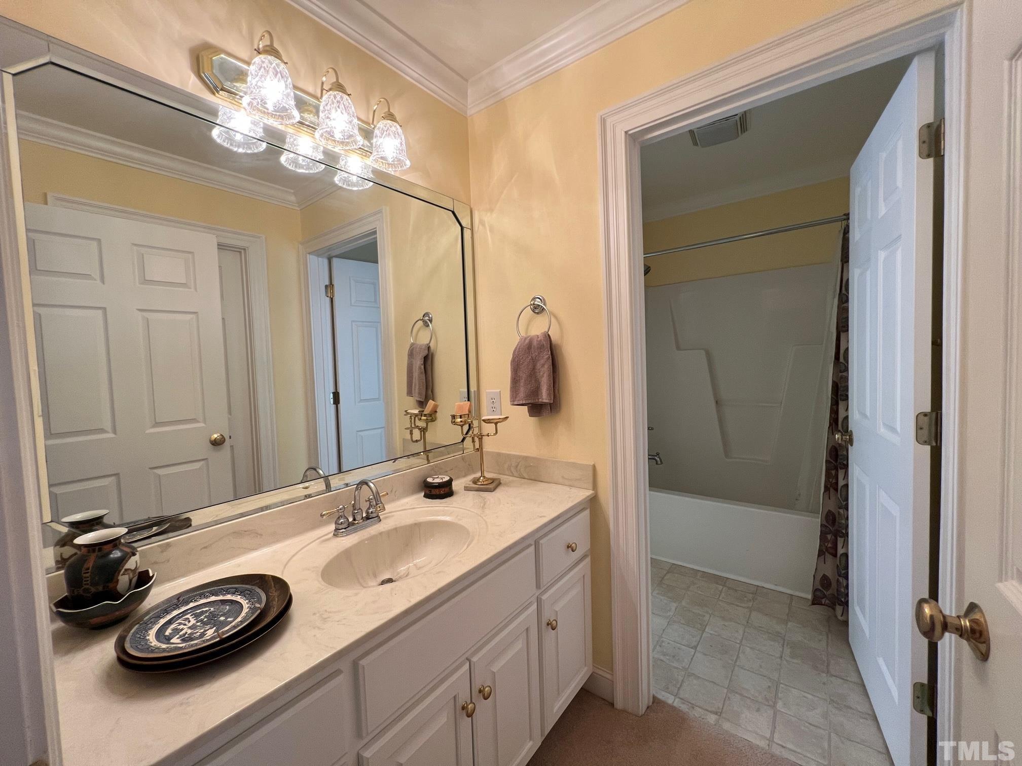 8666 Bailey Road Sims, NC 27880 - Photo 29 of 35 a bathroom with a sink double vanity and a mirror