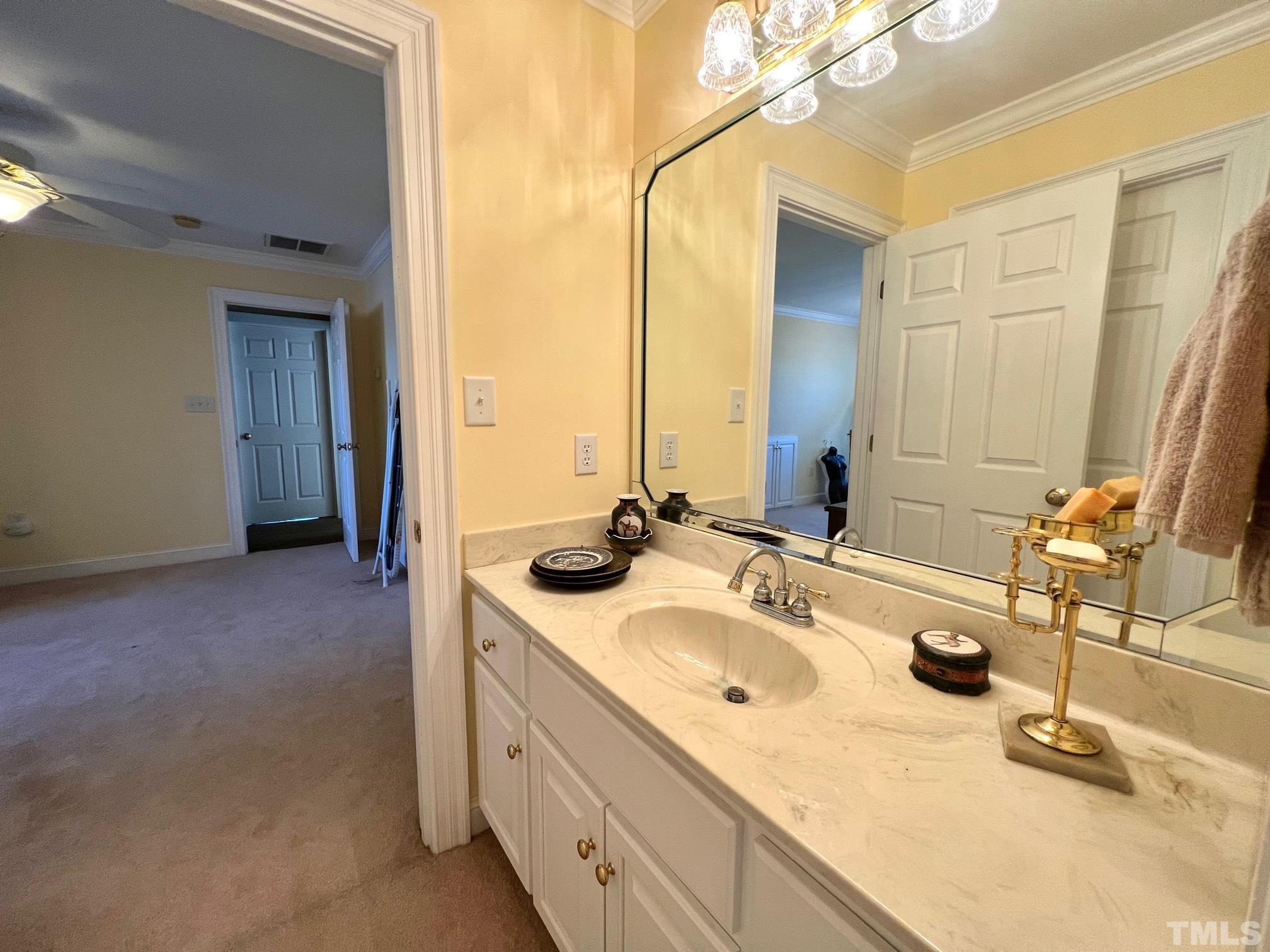 8666 Bailey Road Sims, NC 27880 - Photo 30 of 35 a bathroom with a double vanity sink and a mirror