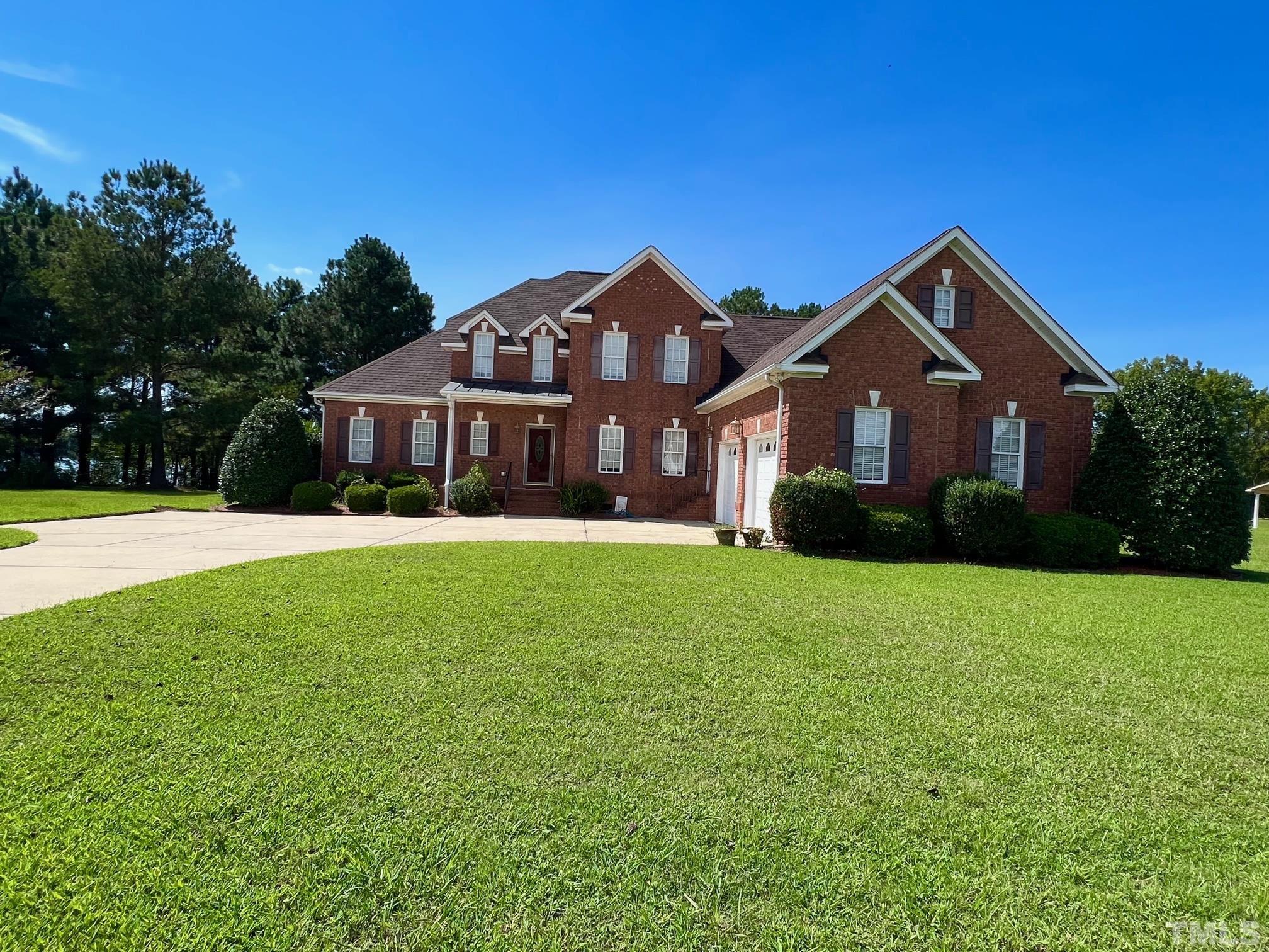 8666 Bailey Road Sims, NC 27880 - Photo 3 of 35 a front view of a house with yard and green space