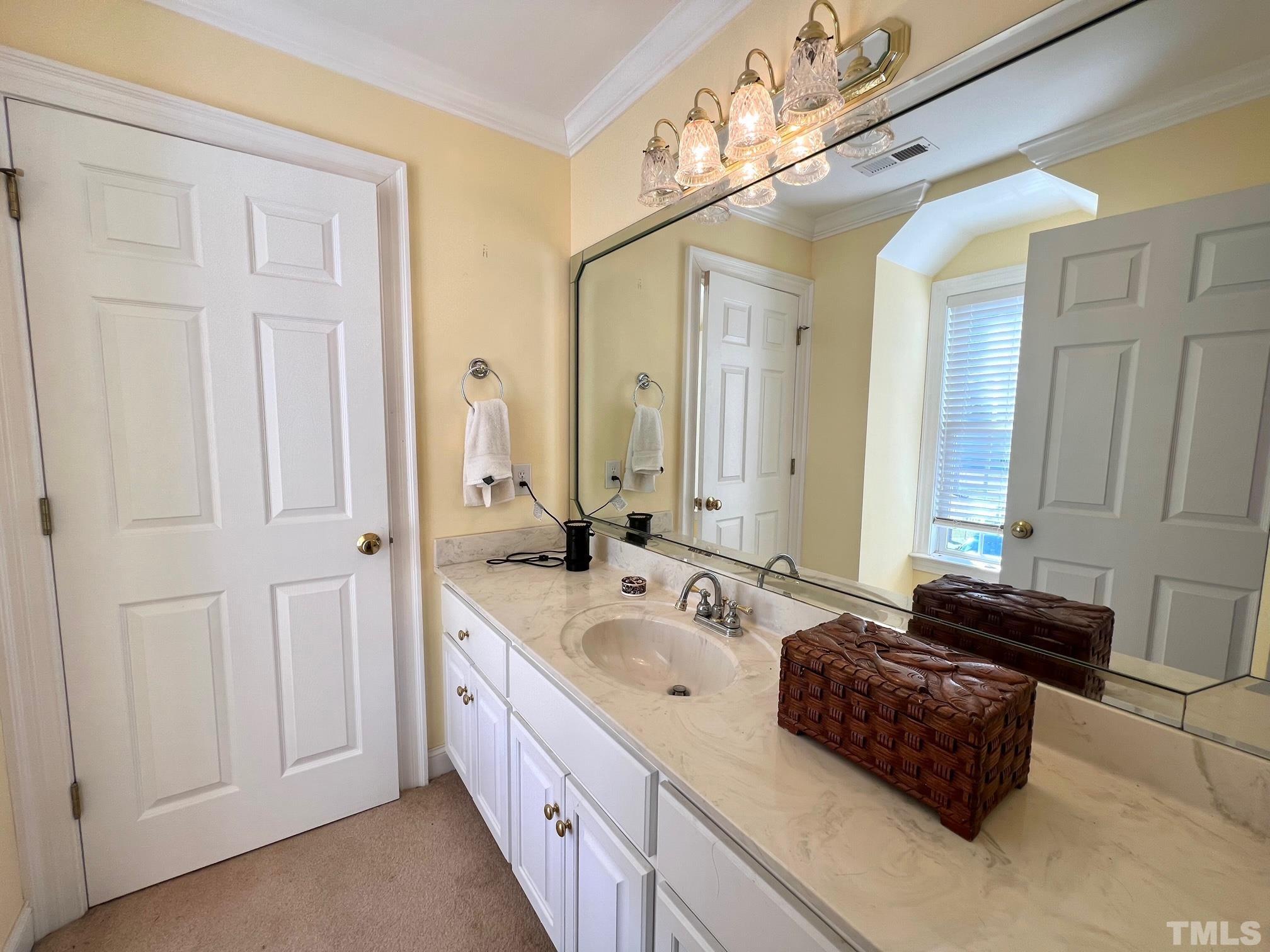 8666 Bailey Road Sims, NC 27880 - Photo 31 of 35 a spacious bathroom with a double vanity sink and a mirror