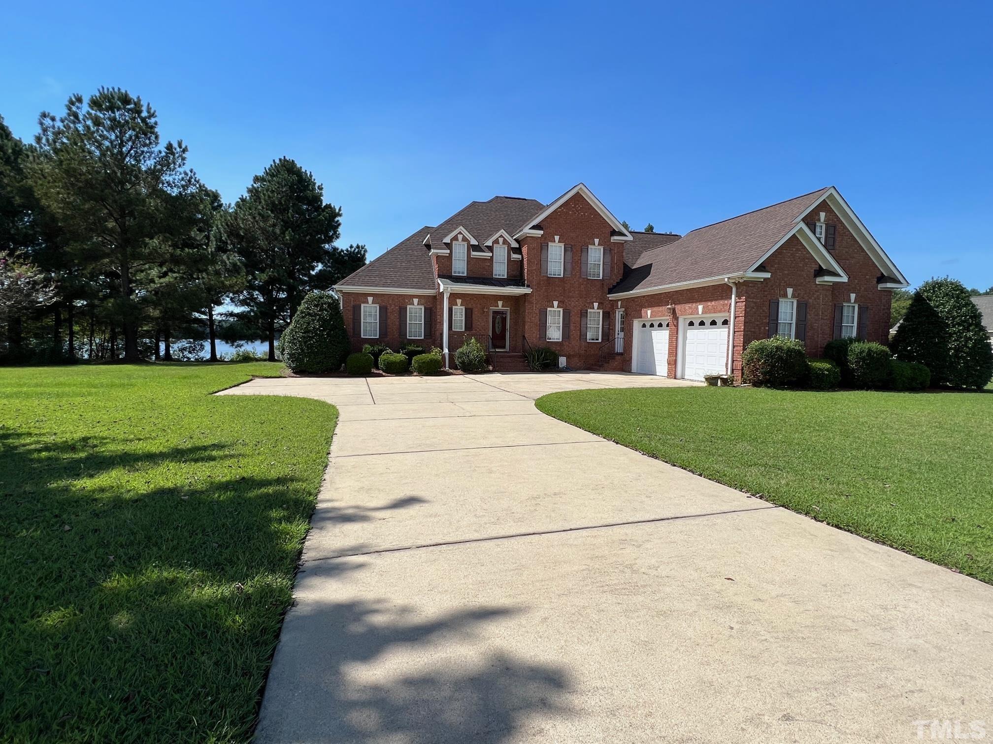 8666 Bailey Road Sims, NC 27880 - Photo 4 of 35 a front view of a house with a yard