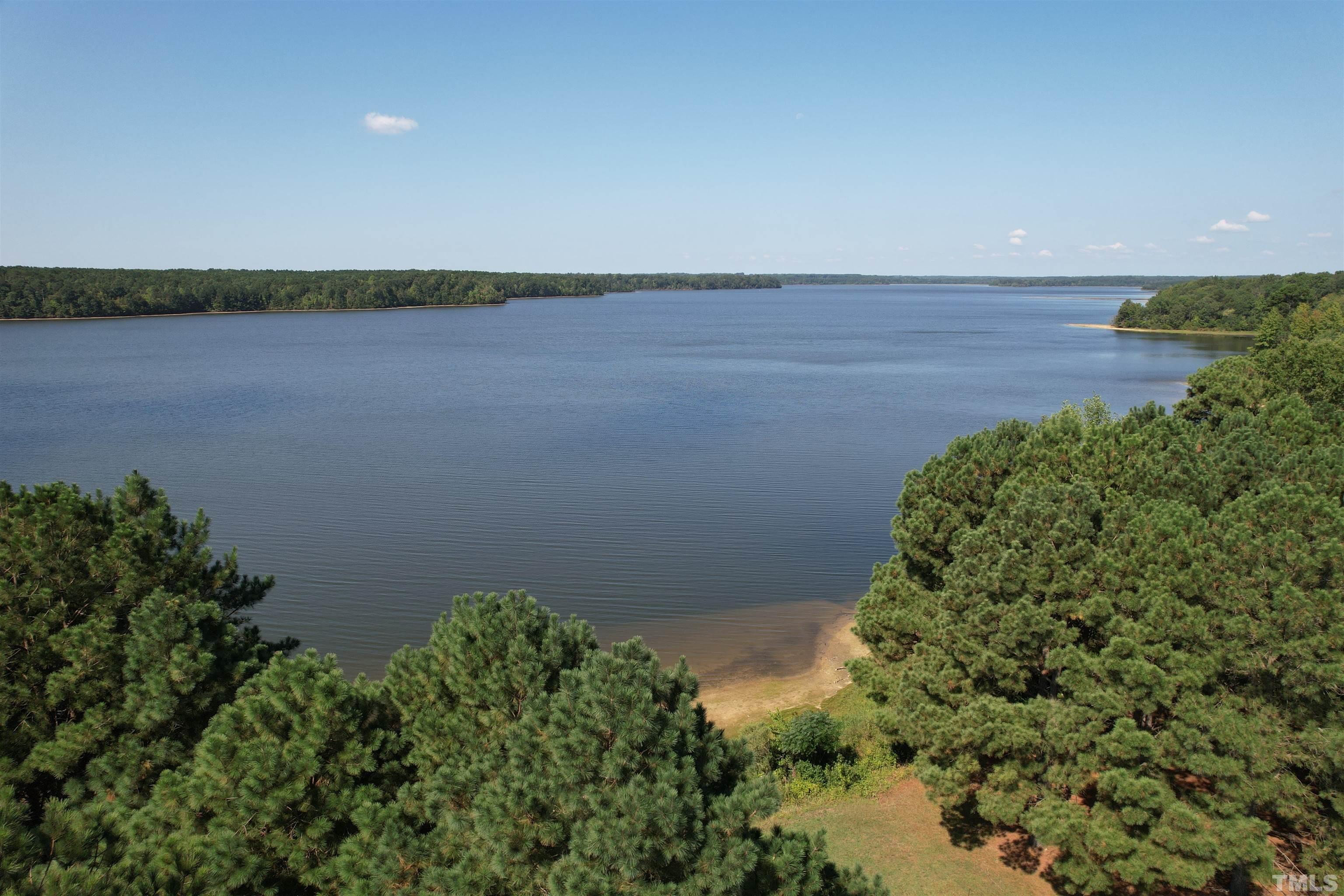8666 Bailey Road Sims, NC 27880 - Photo 9 of 35 a view of a lake with a city