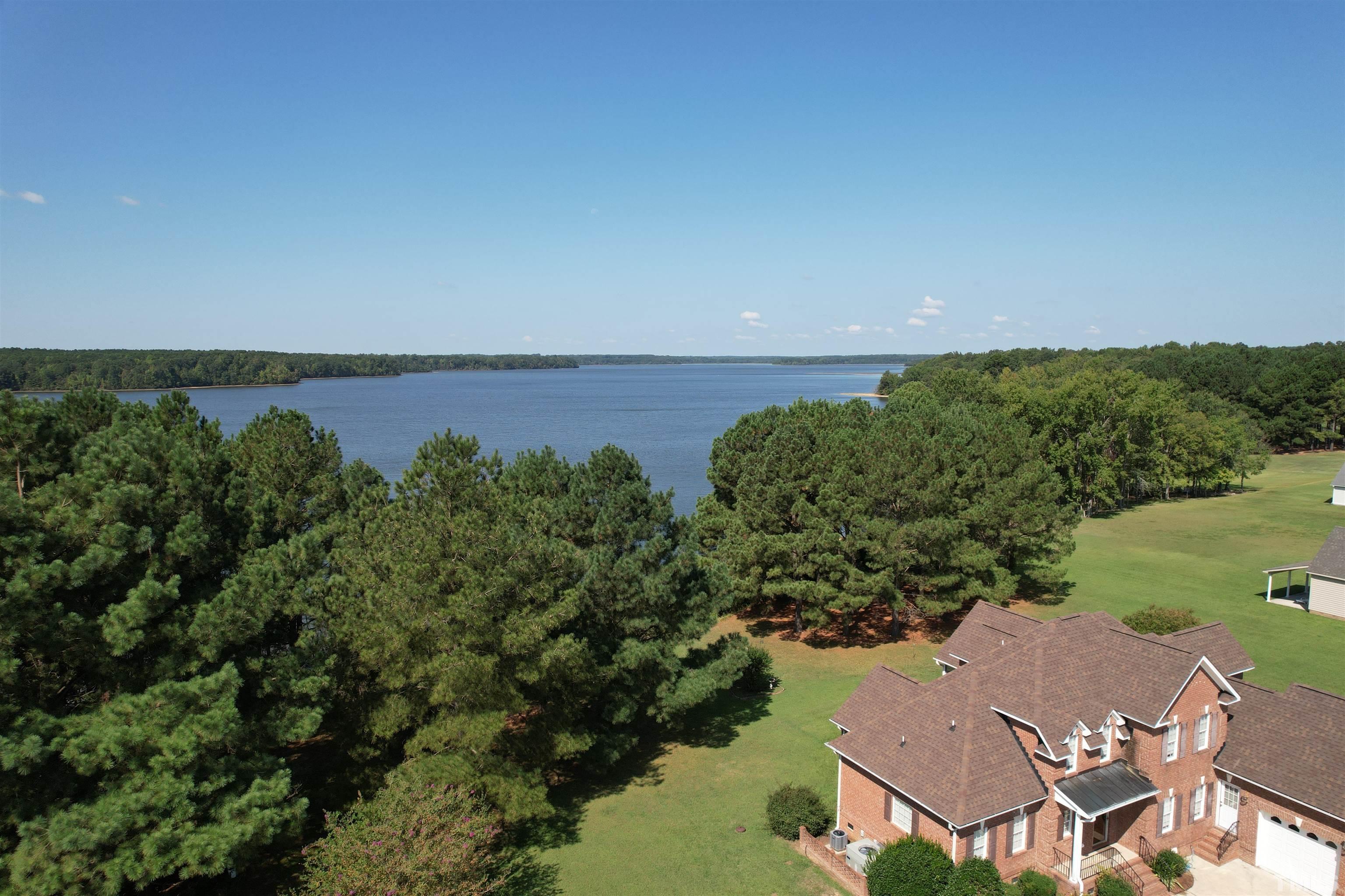8666 Bailey Road Sims, NC 27880 - Photo 10 of 35 an aerial view of a house with outdoor space and lake view