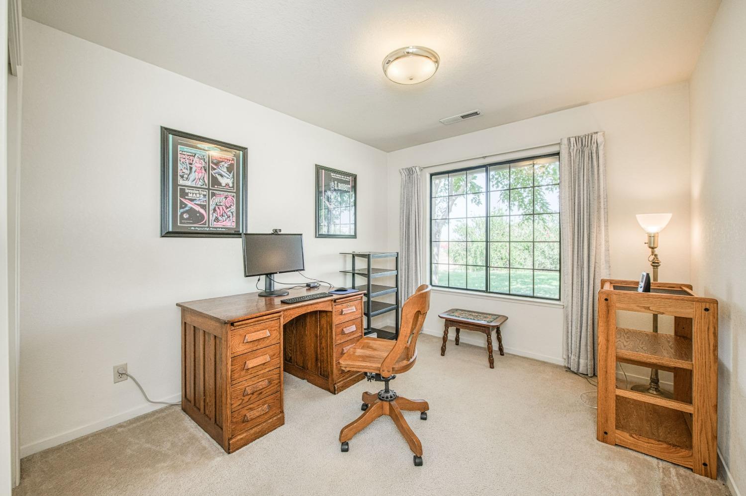 36730 Highway 145 Madera, CA 93636 - Photo 15 of 30 a view of a workspace with furniture and a window