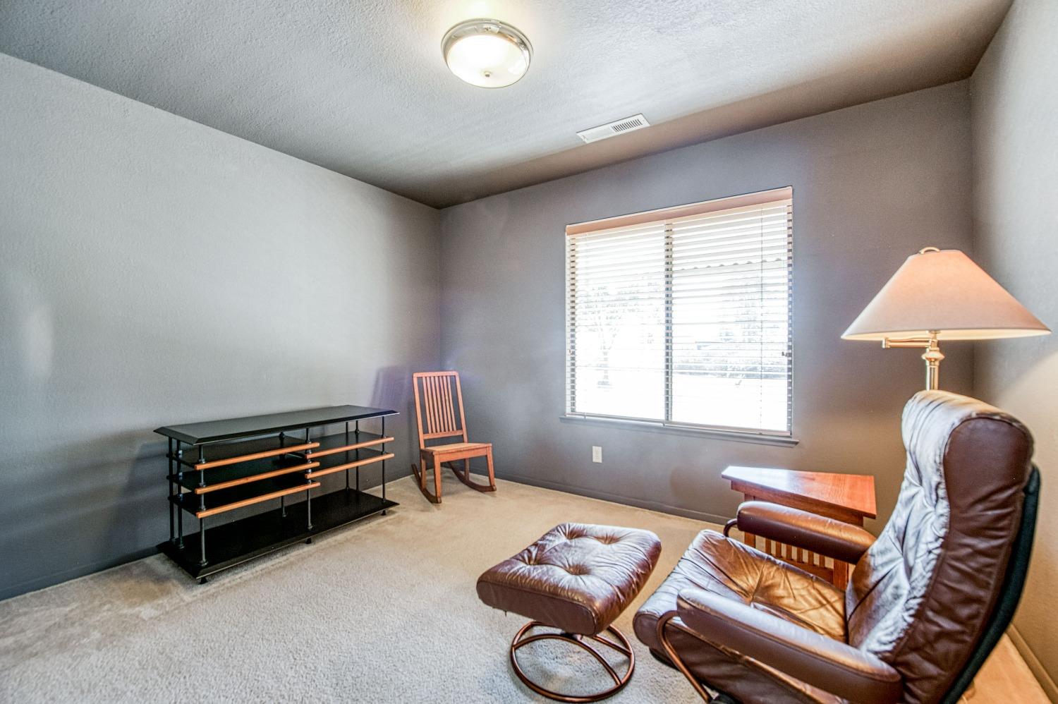 36730 Highway 145 Madera, CA 93636 - Photo 17 of 30 a bedroom with furniture and a window