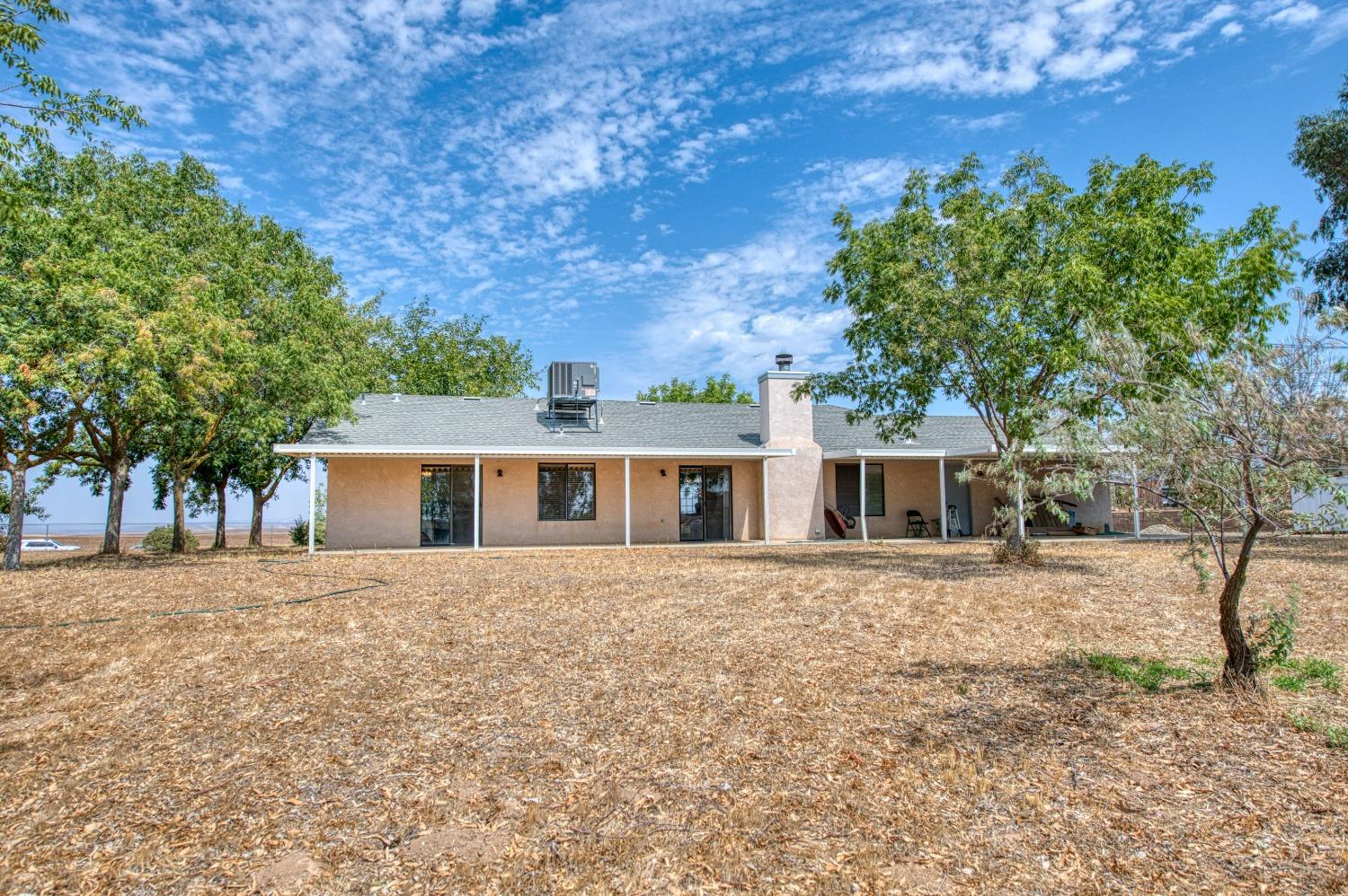 36730 Highway 145 Madera, CA 93636 - Photo 23 of 30 front view of a house with a yard