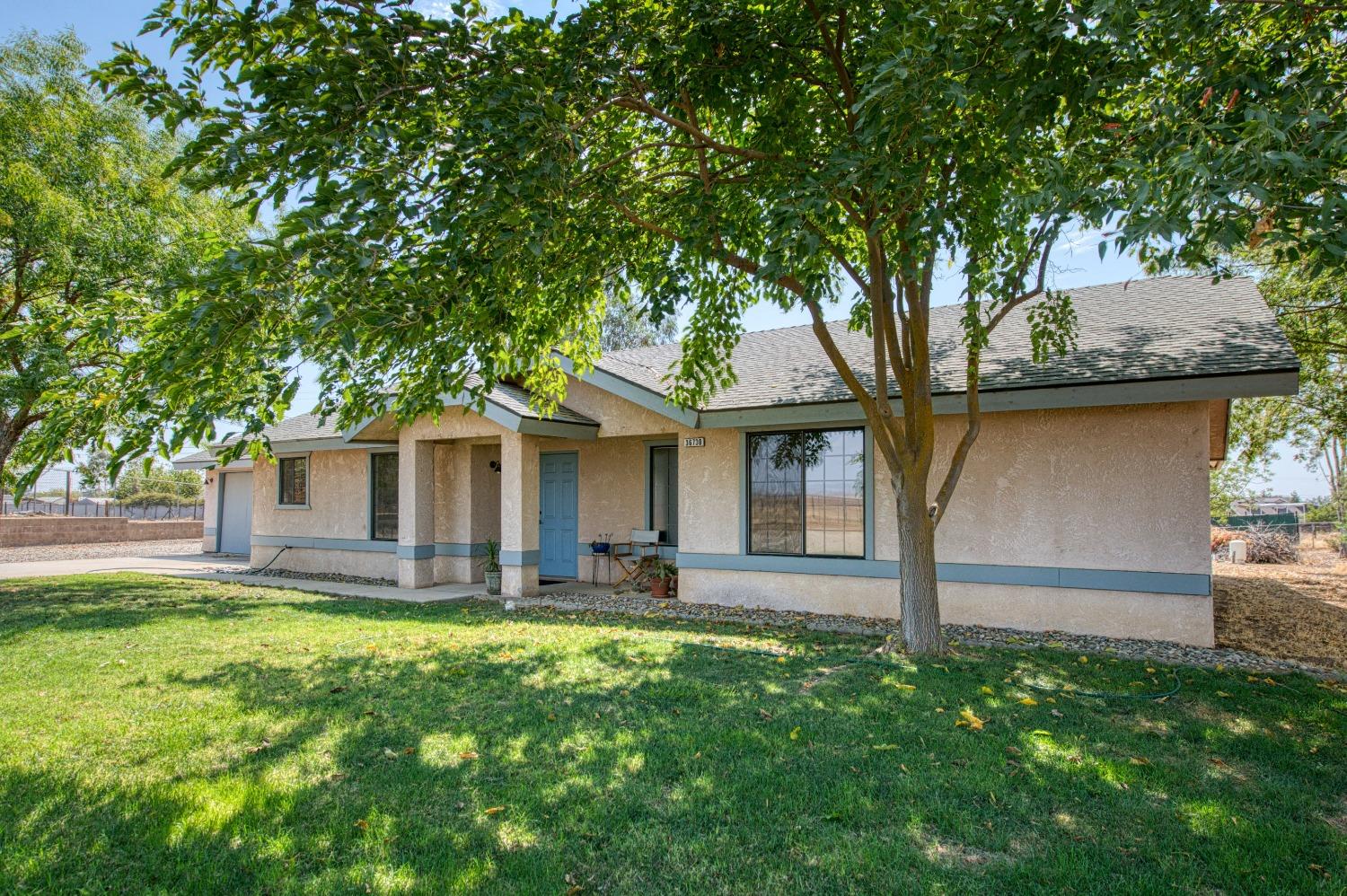 36730 Highway 145 Madera, CA 93636 - Photo 3 of 30 a front view of house with yard and green space