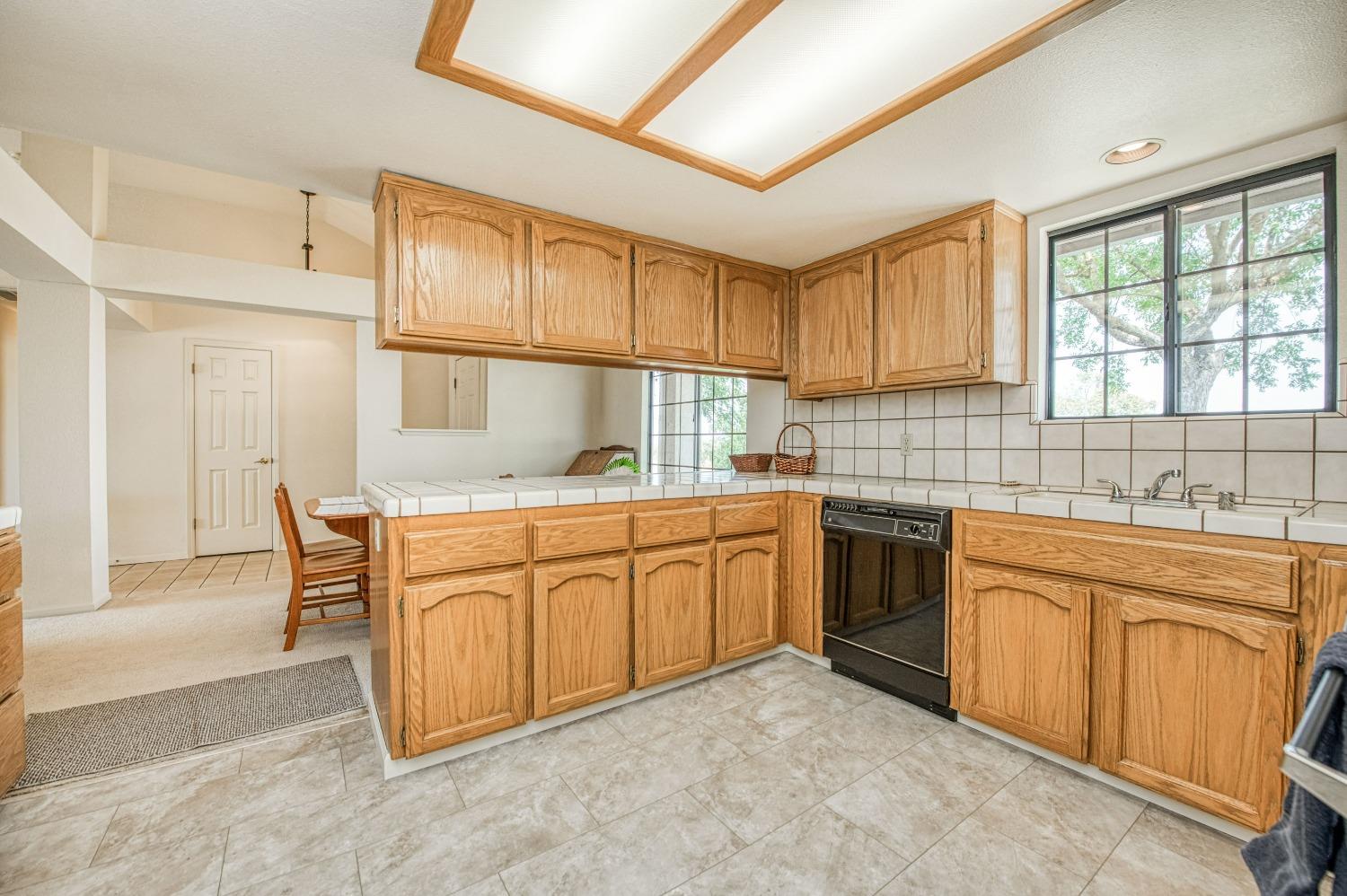 36730 Highway 145 Madera, CA 93636 - Photo 10 of 30 a kitchen that has cabinets stove top oven and sink