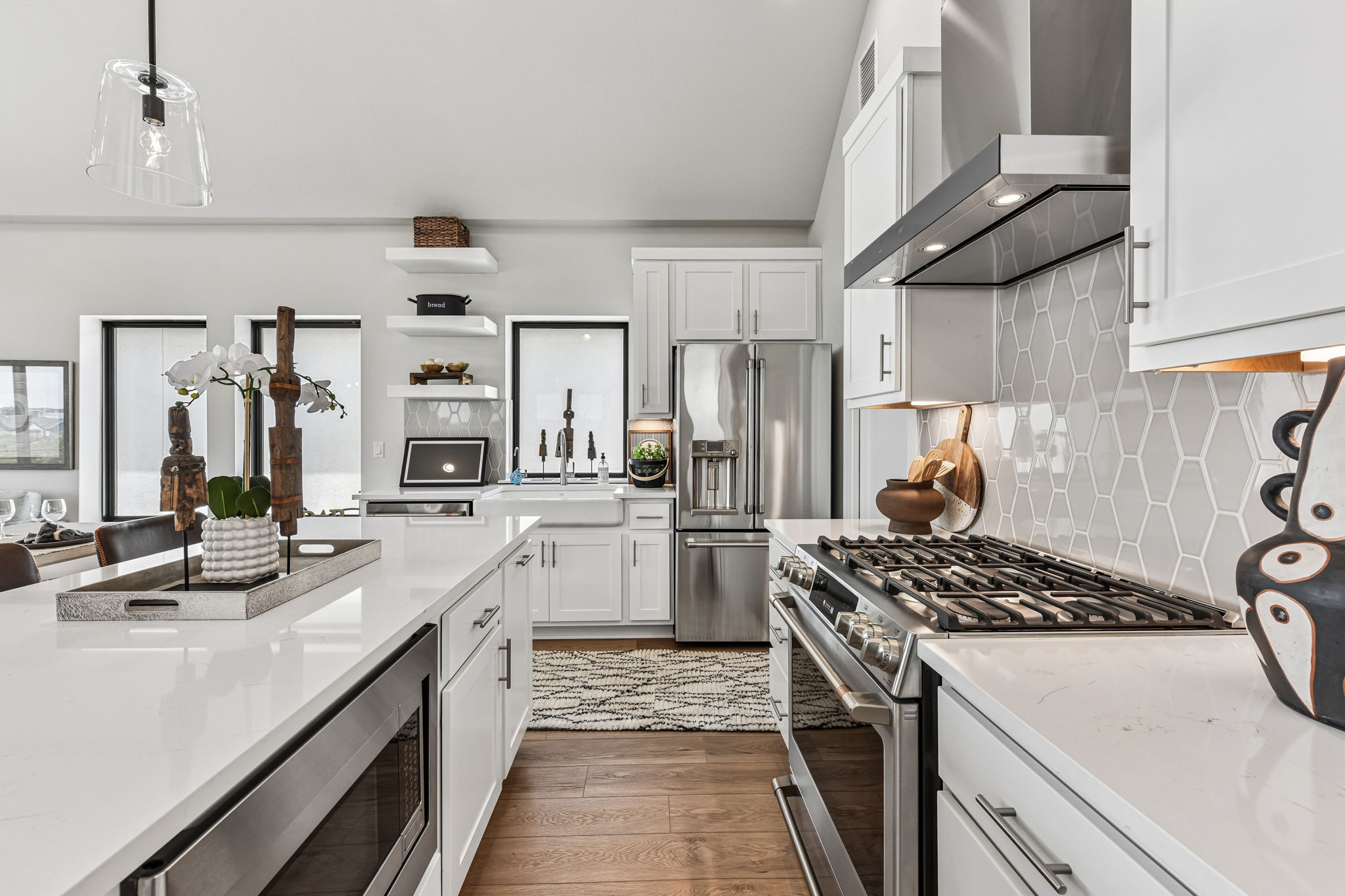 9101 Cattle Baron Path Austin, TX 78747 - Photo 16 of 40 Culinary dreams come alive in this kitchen, featuring ample counter space and a modern gas range.