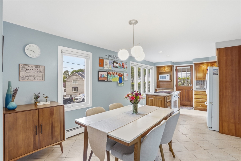 115 Collincote Street Stoneham, MA 02180 - Photo 6 of 25 a view of a dining room with furniture window and outside view