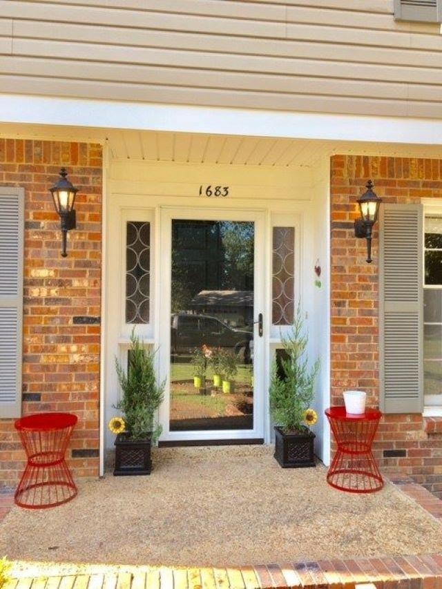 a backyard of a house with outdoor seating