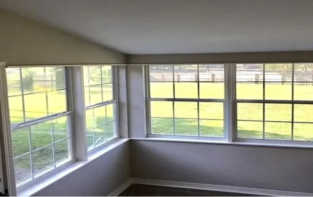 a view of an empty room with a window