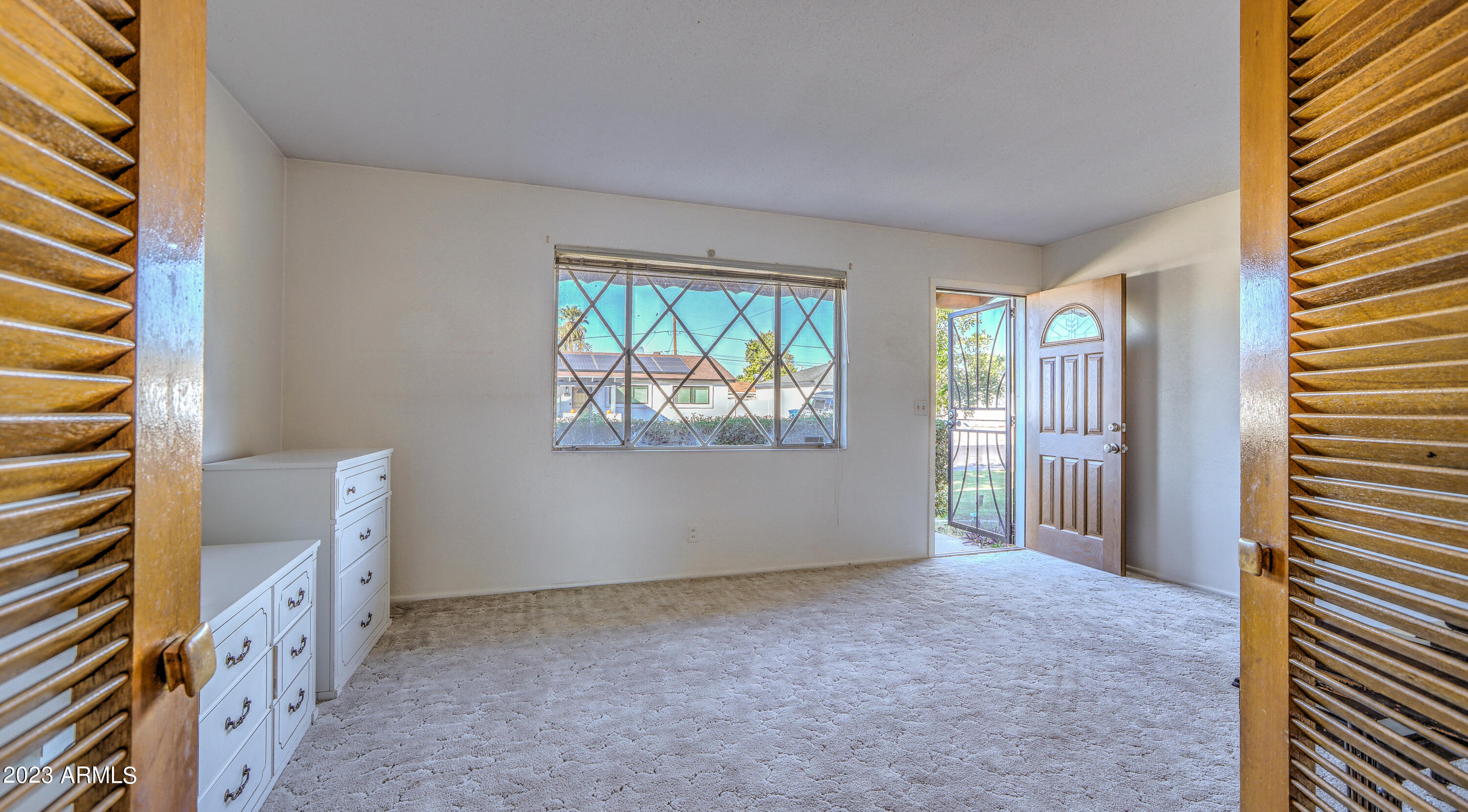 3349 West Charter Oak Road Phoenix, AZ 85029 - Photo 6 of 32 Entry Room Privacy Doors to Kitchen