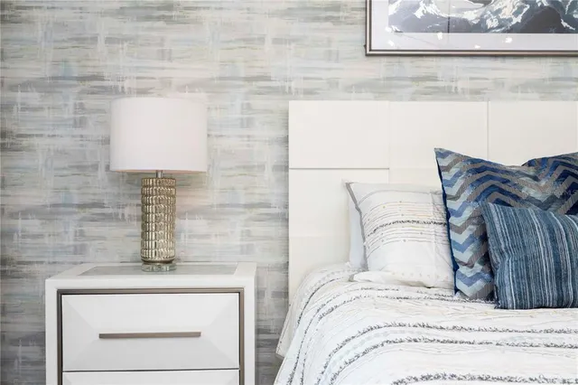 a bedroom with a bed and couch