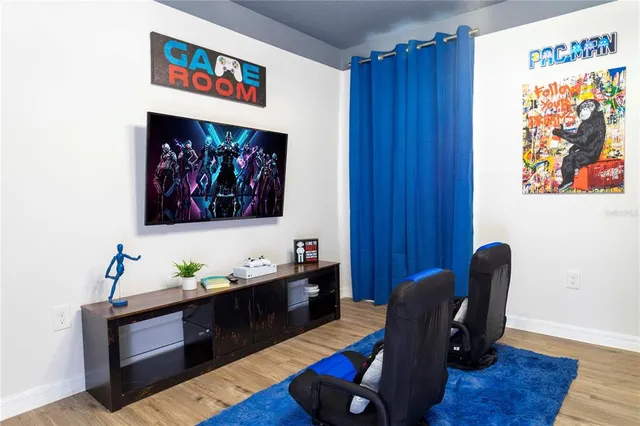 a view of a hallway with wooden floor and closet