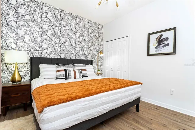 a view of kitchen with stainless steel appliances kitchen island