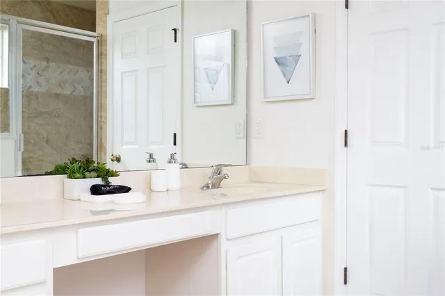 a spacious bathroom with a double vanity sink mirror and double