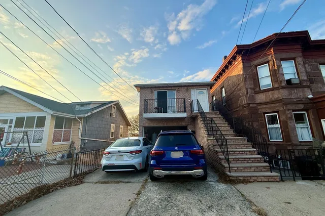 a car parked in front of a house