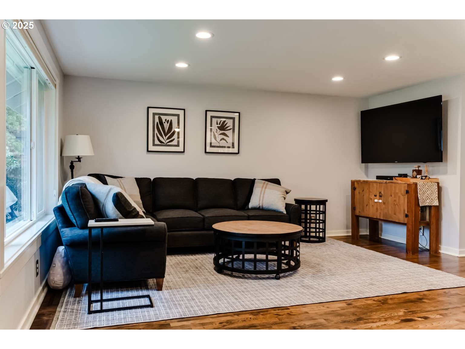 1253 Alfaretta Drive Eugene, OR 97401 - Photo 13 of 33 a living room with furniture and a flat screen tv
