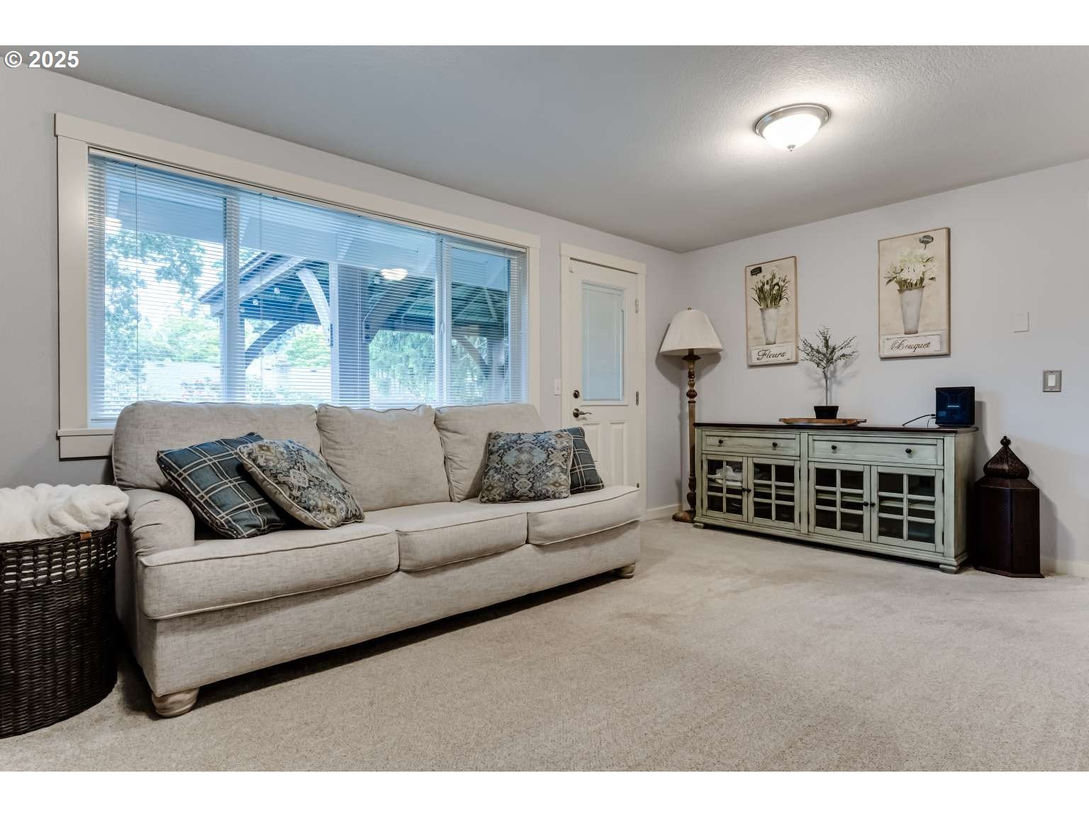 1253 Alfaretta Drive Eugene, OR 97401 - Photo 17 of 33 a living room with furniture a large window and a flat screen tv