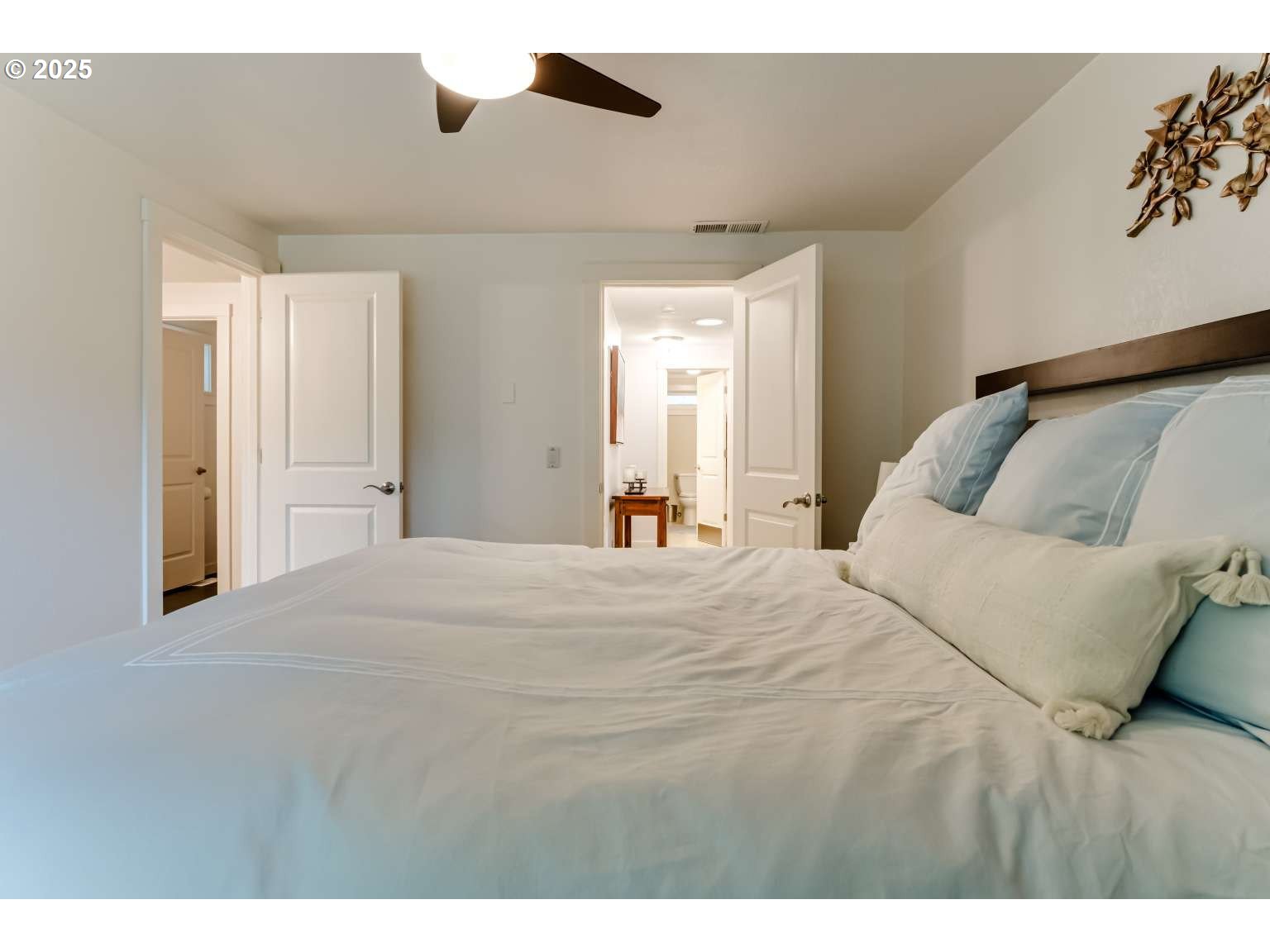 1253 Alfaretta Drive Eugene, OR 97401 - Photo 25 of 33 a bedroom with a bed and a painting