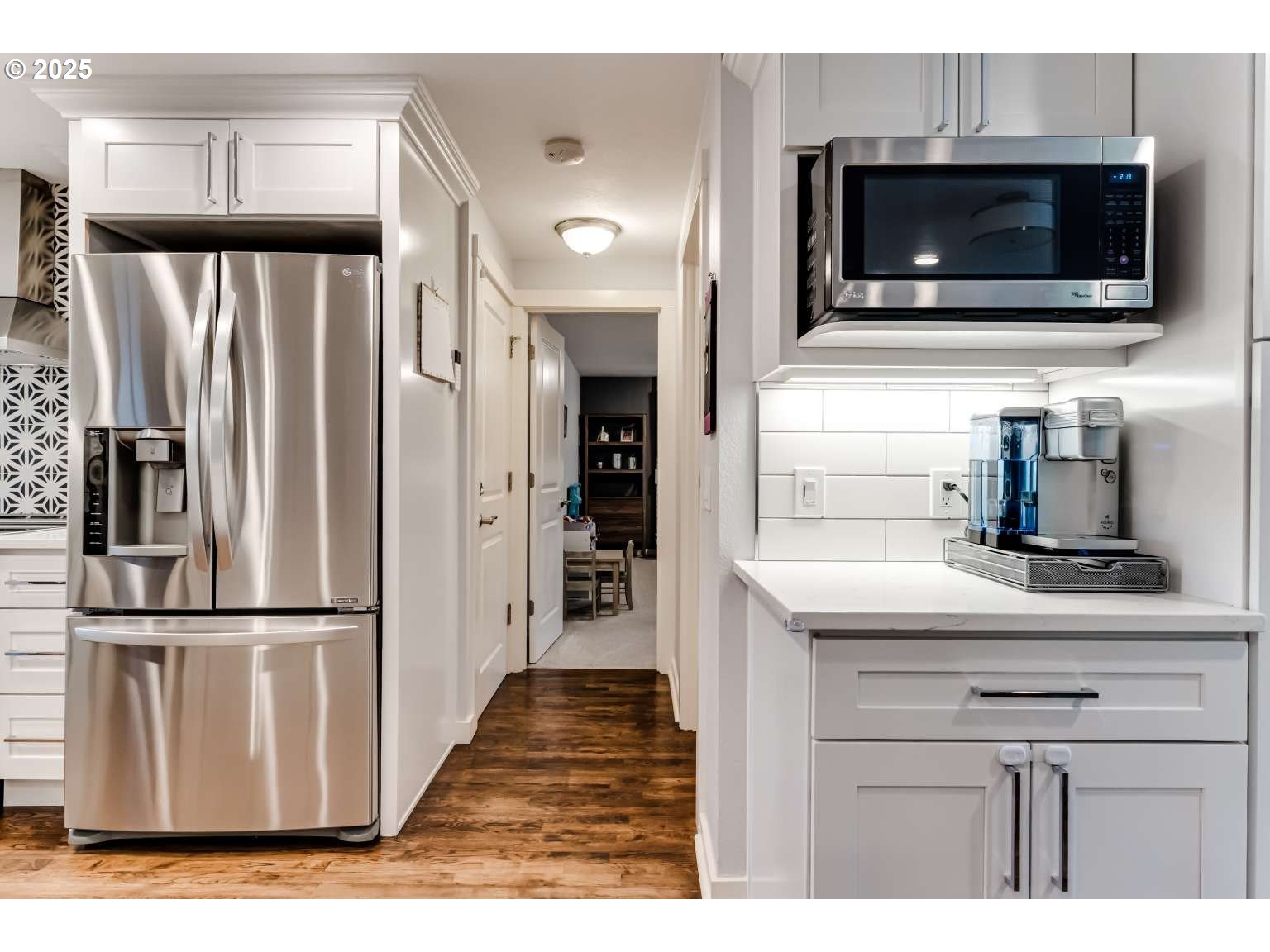 1253 Alfaretta Drive Eugene, OR 97401 - Photo 10 of 33 a kitchen with a refrigerator and microwave