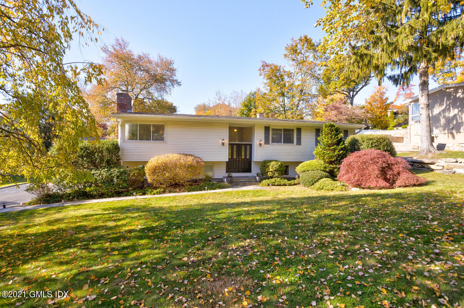 89 Florence Road Riverside, CT 06878 - Photo 1 of 34 a front view of house with yard and trees around