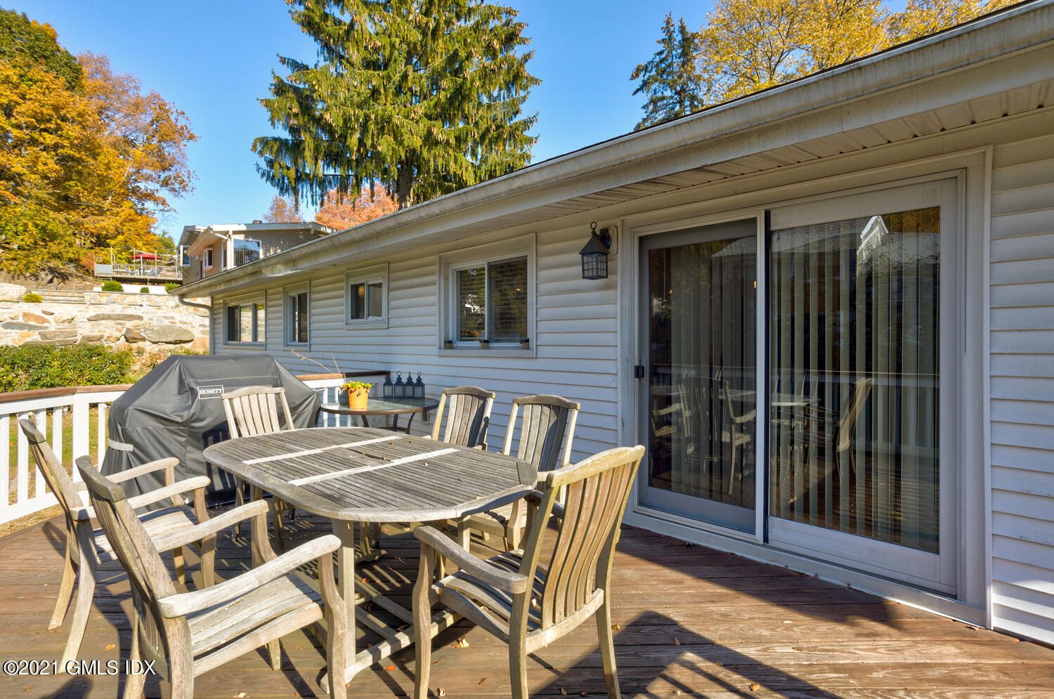 89 Florence Road Riverside, CT 06878 - Photo 31 of 34 a view of a patio with table and chairs and potted plants