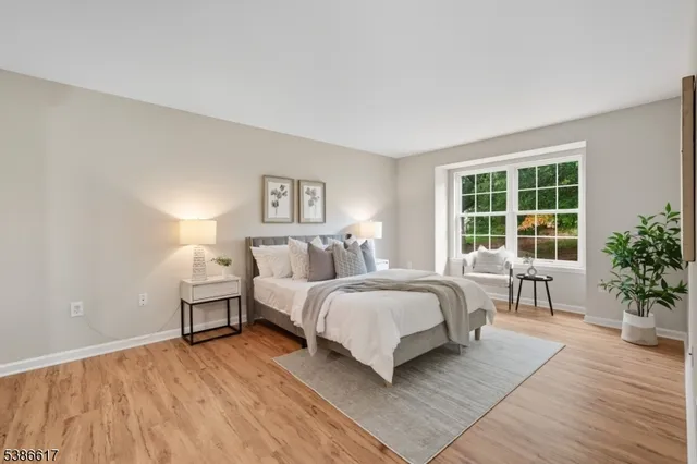 a bed room with a bed and a chair