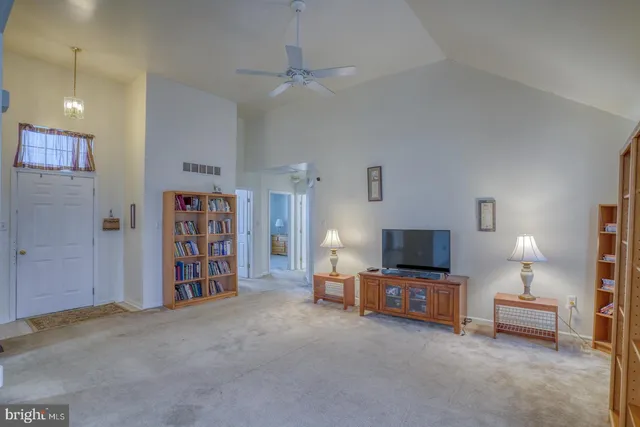 a view of a livingroom with furniture and a flat screen tv