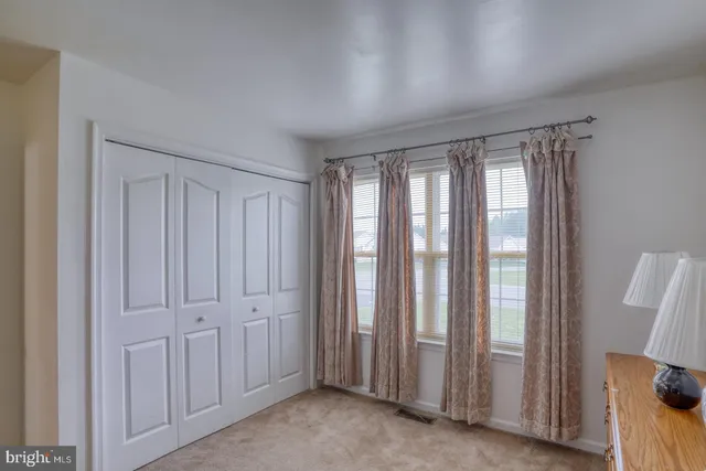 a view of empty room with windows