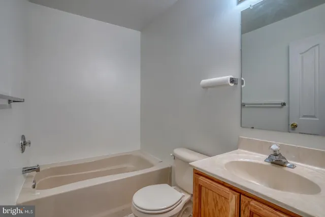 a bathroom with a sink toilet and a bathtub