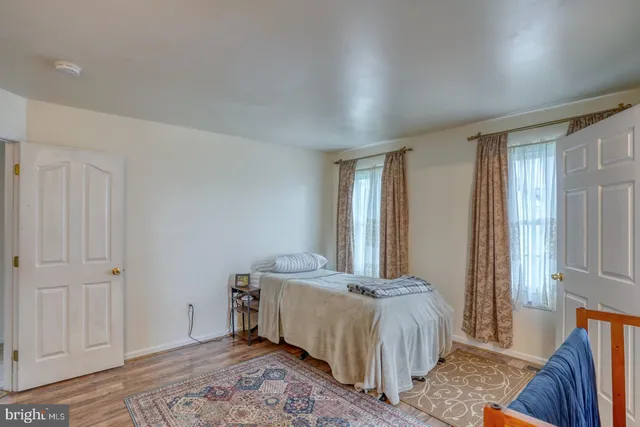 a bed room with a bed and a window