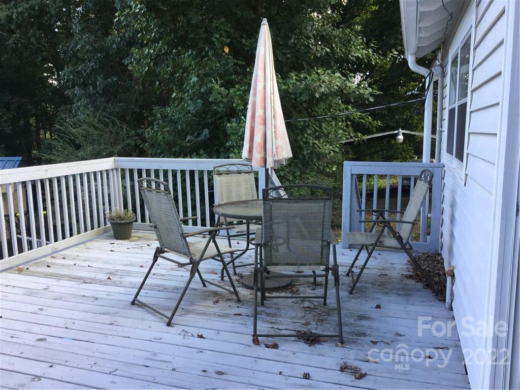 125 John Smith Road Rutherfordton, NC 28139 - Photo 5 of 13 a view of roof deck with a table and chairs