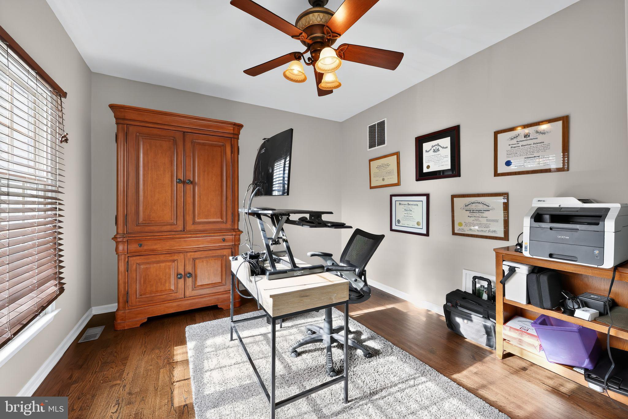 39 Bramley Road Moorestown, NJ 08057 - Photo 12 of 28 a living room with furniture and a flat screen tv