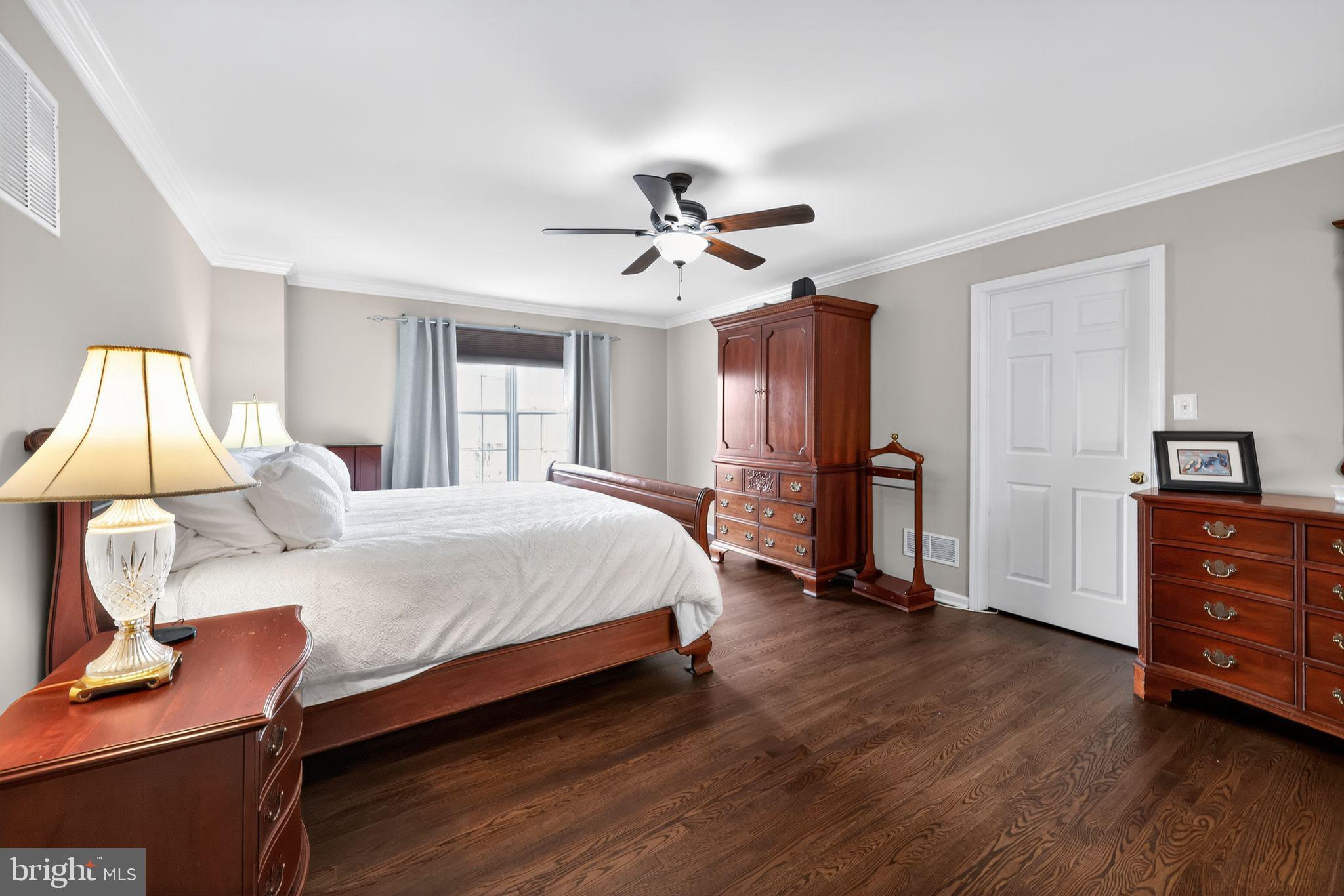 39 Bramley Road Moorestown, NJ 08057 - Photo 14 of 28 a spacious bedroom with a bed and wooden floor