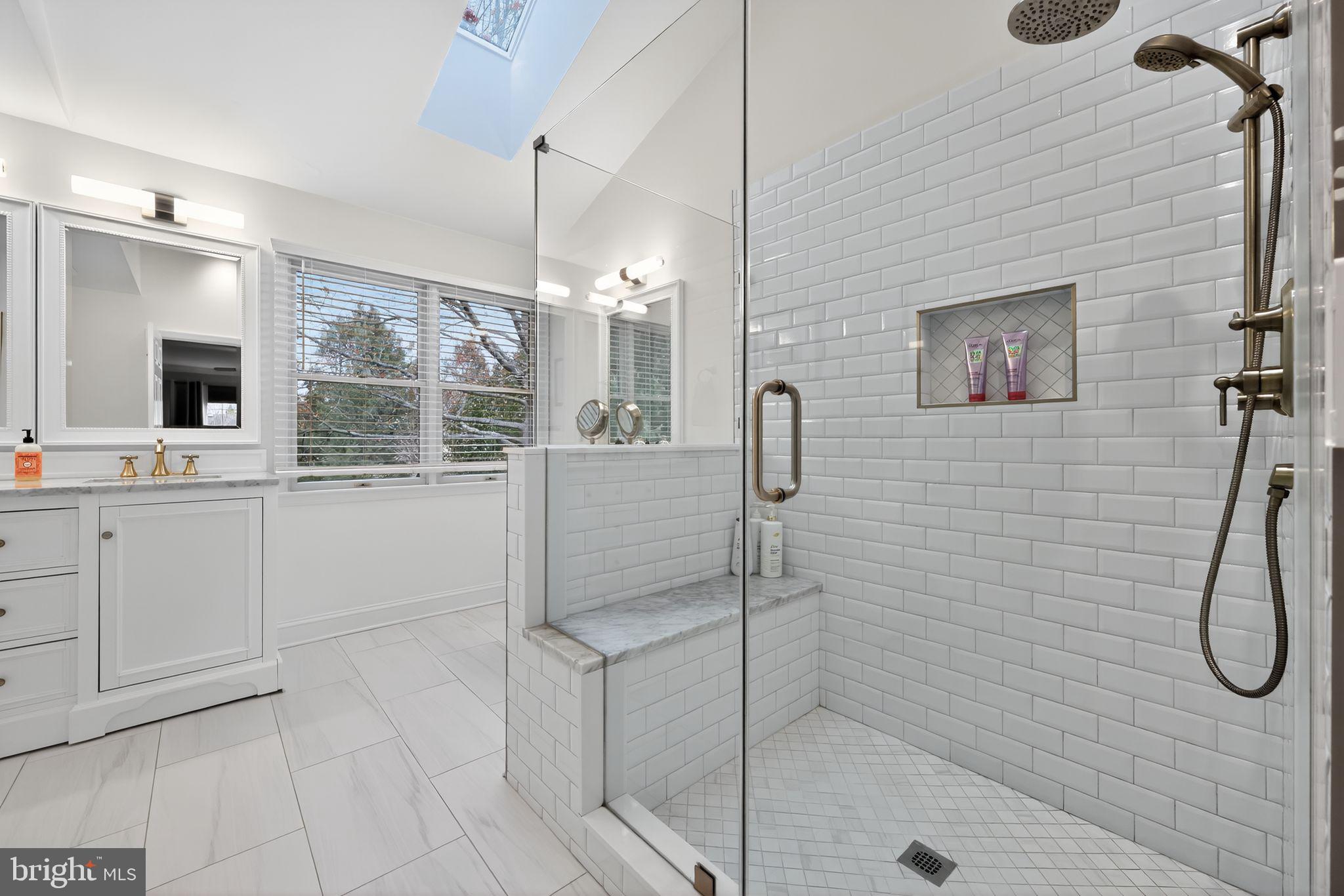 39 Bramley Road Moorestown, NJ 08057 - Photo 16 of 28 a bathroom with a sink a mirror and a shower