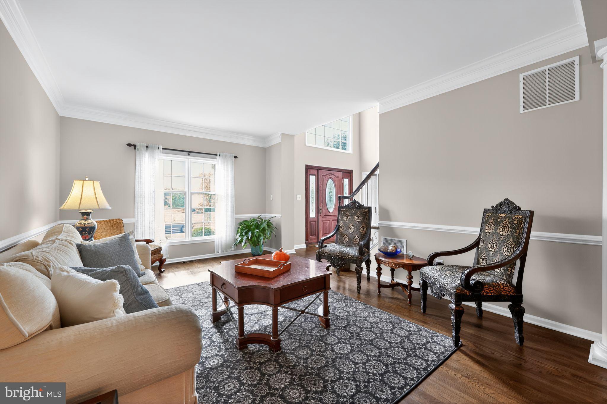 39 Bramley Road Moorestown, NJ 08057 - Photo 3 of 28 a living room with furniture and a window