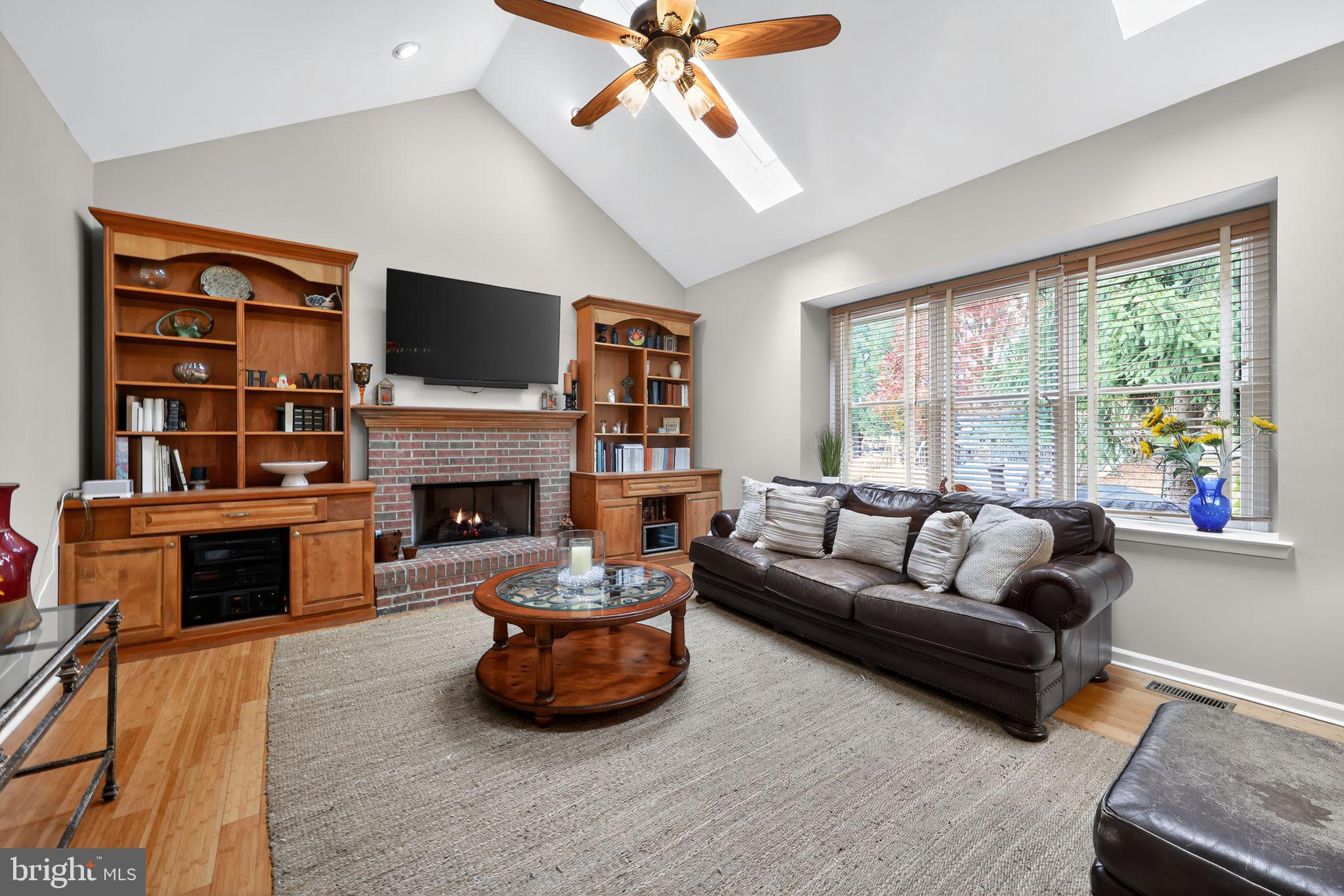 39 Bramley Road Moorestown, NJ 08057 - Photo 10 of 28 a living room with furniture fireplace and flat screen tv