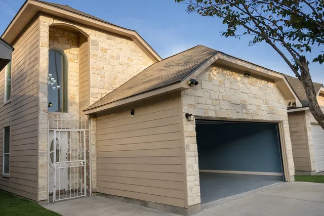 a front view of a house with a large window