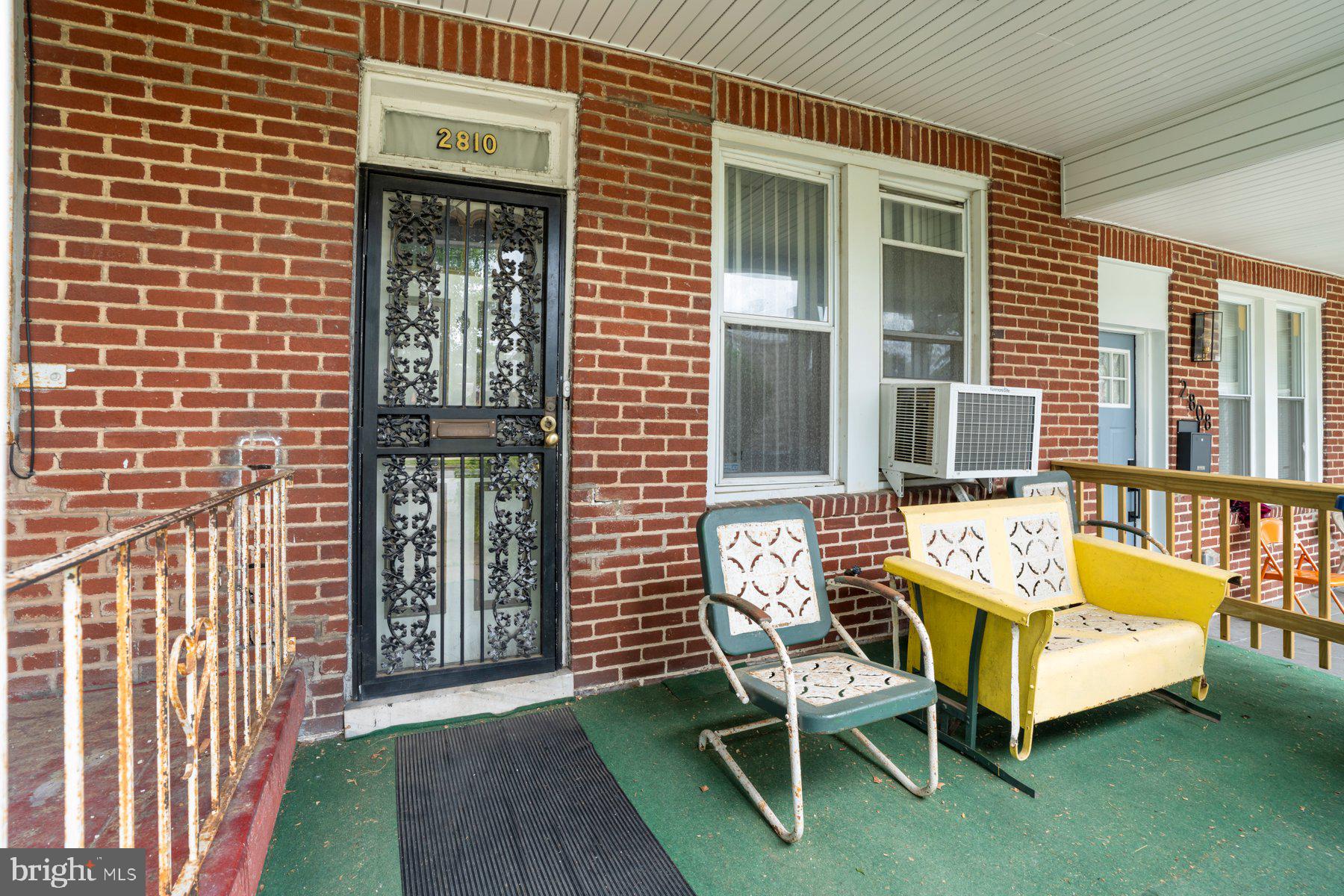 2810 Ellicott Driveway Baltimore, MD 21216 - Photo 3 of 11 a balcony with furniture and a gate