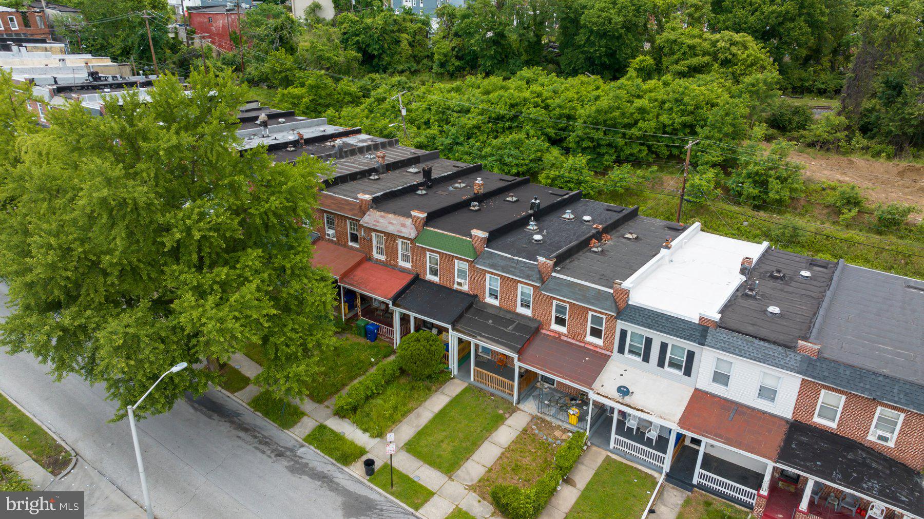 2810 Ellicott Driveway Baltimore, MD 21216 - Photo 4 of 11 an aerial view of residential house with outdoor space and trees all around