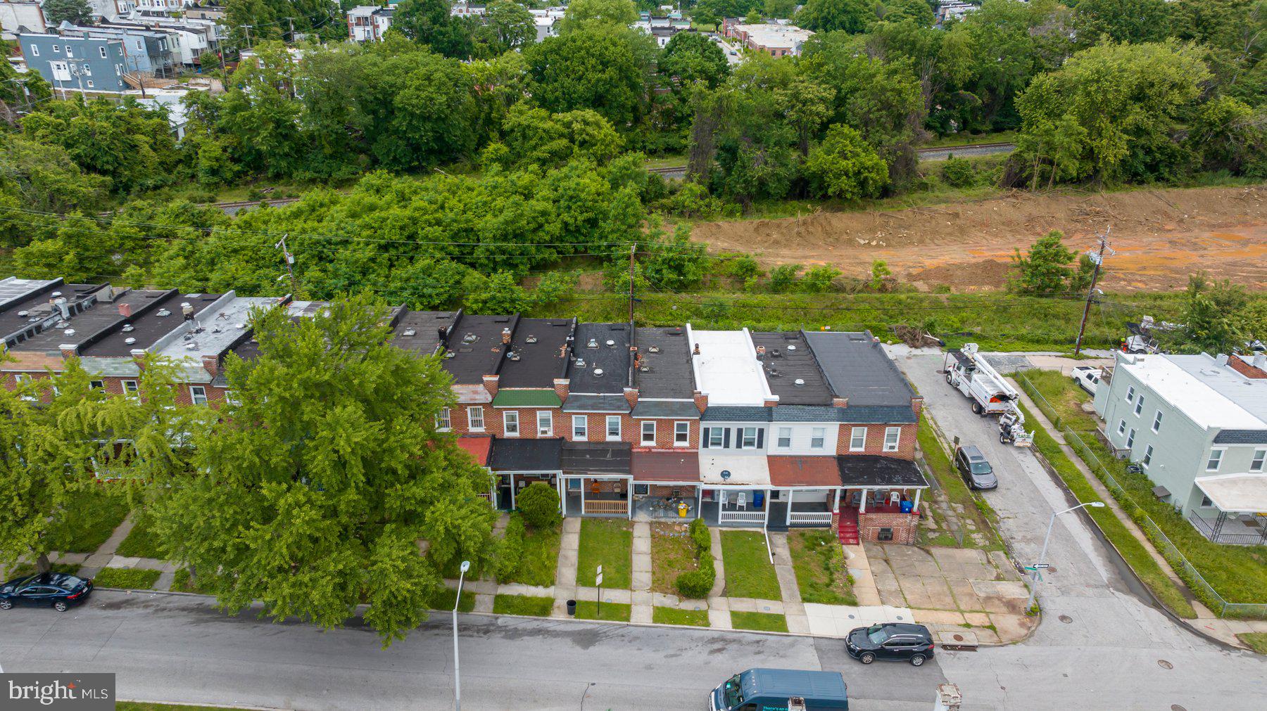 2810 Ellicott Driveway Baltimore, MD 21216 - Photo 5 of 11 an aerial view of multi story residential apartment building with a yard