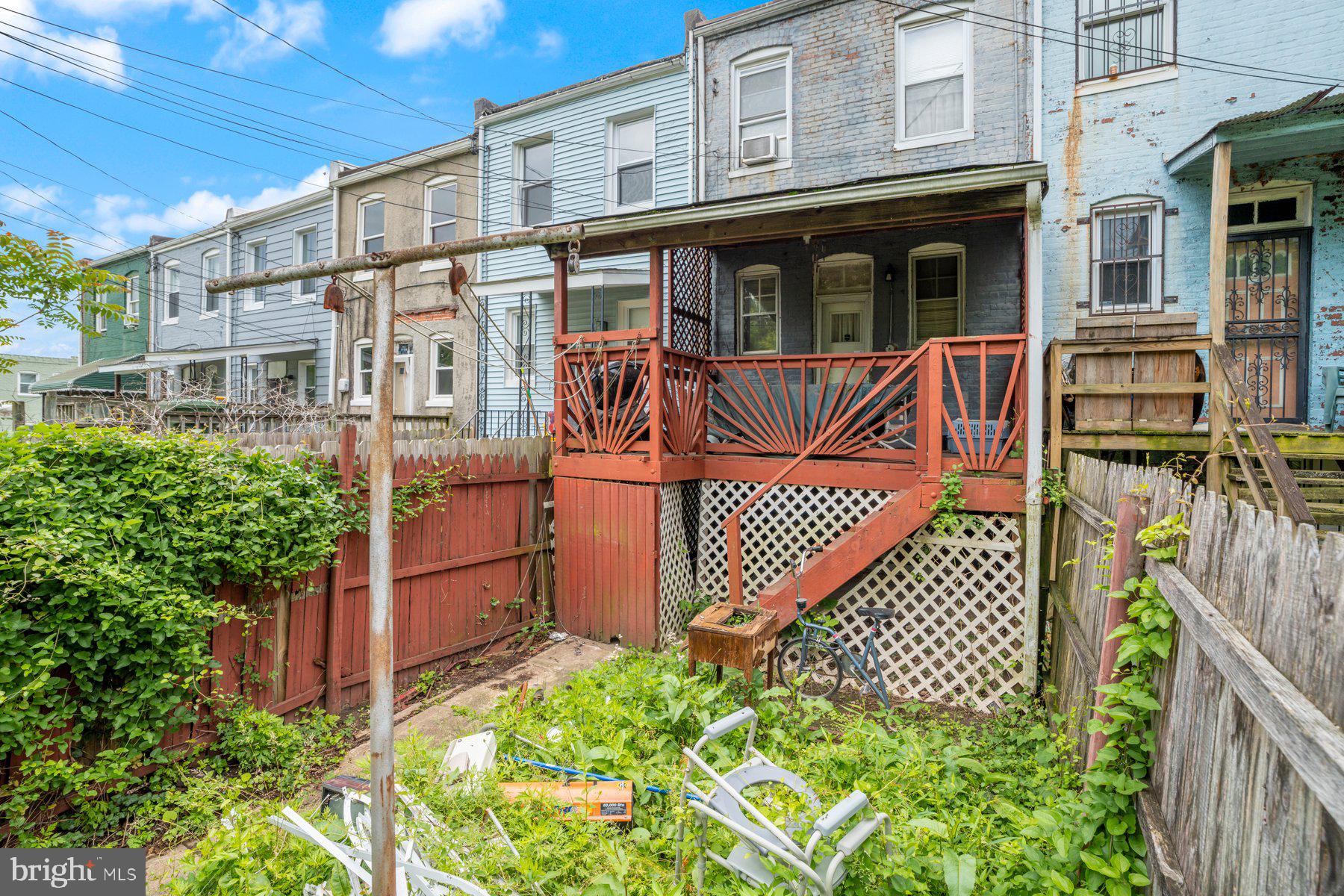 2810 Ellicott Driveway Baltimore, MD 21216 - Photo 8 of 11 a view of a brick house with wooden fence