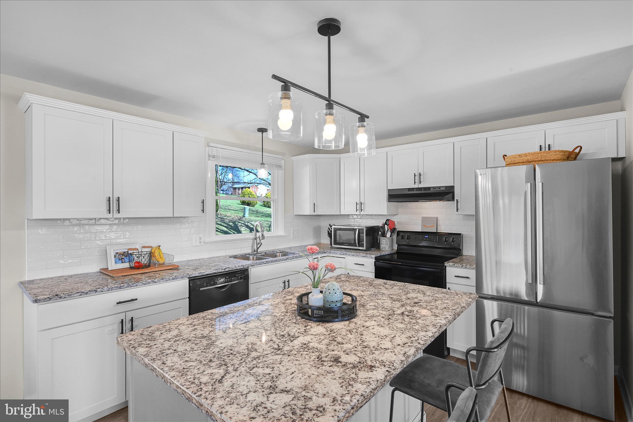 668 Scotland Road Quarryville, PA 17566 - Photo 14 of 41 a kitchen with a refrigerator a stove a sink and a refrigerator