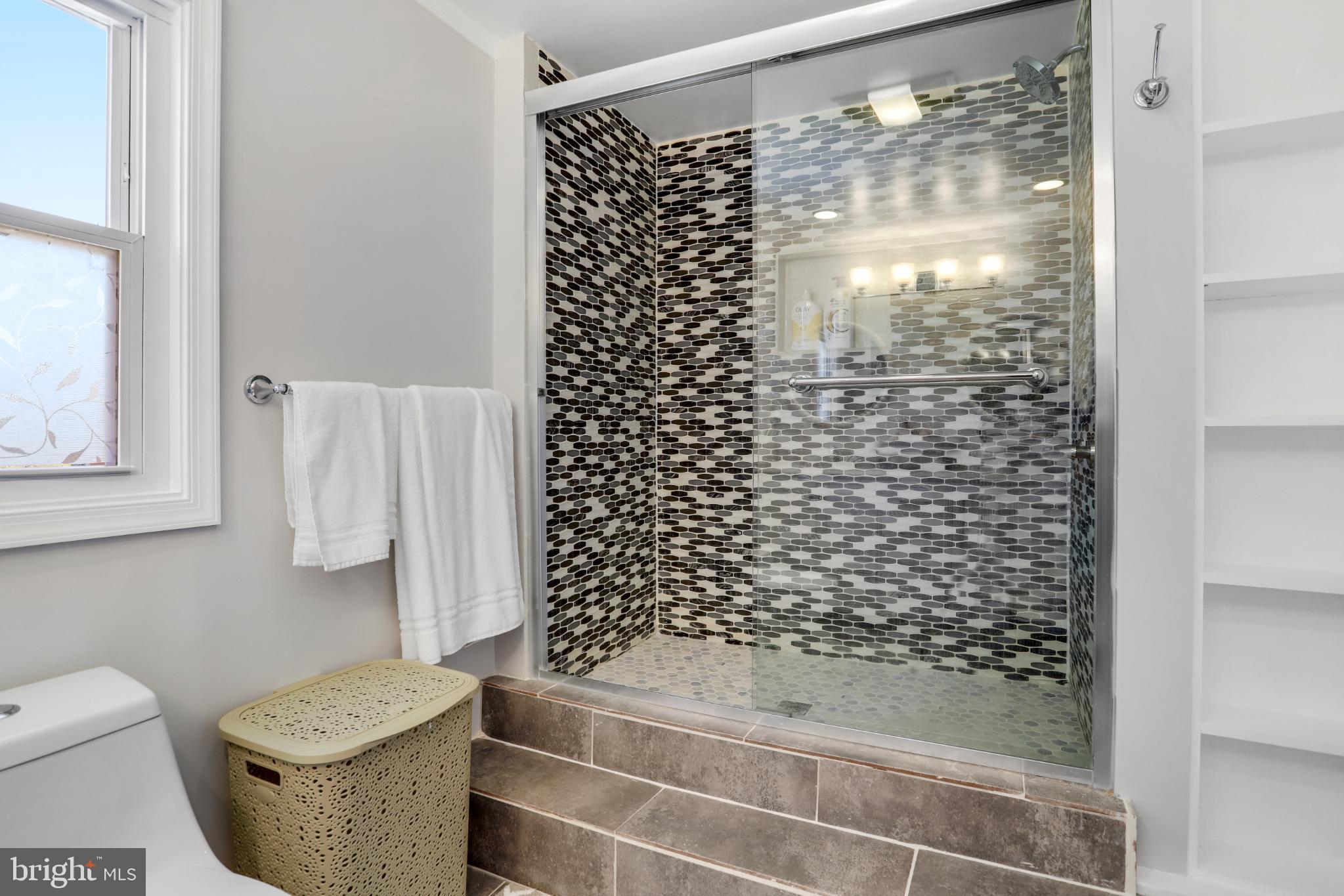 6908 Barrett Road Falls Church, VA 22042 - Photo 13 of 44 Modern bathroom with stylish tile accents.