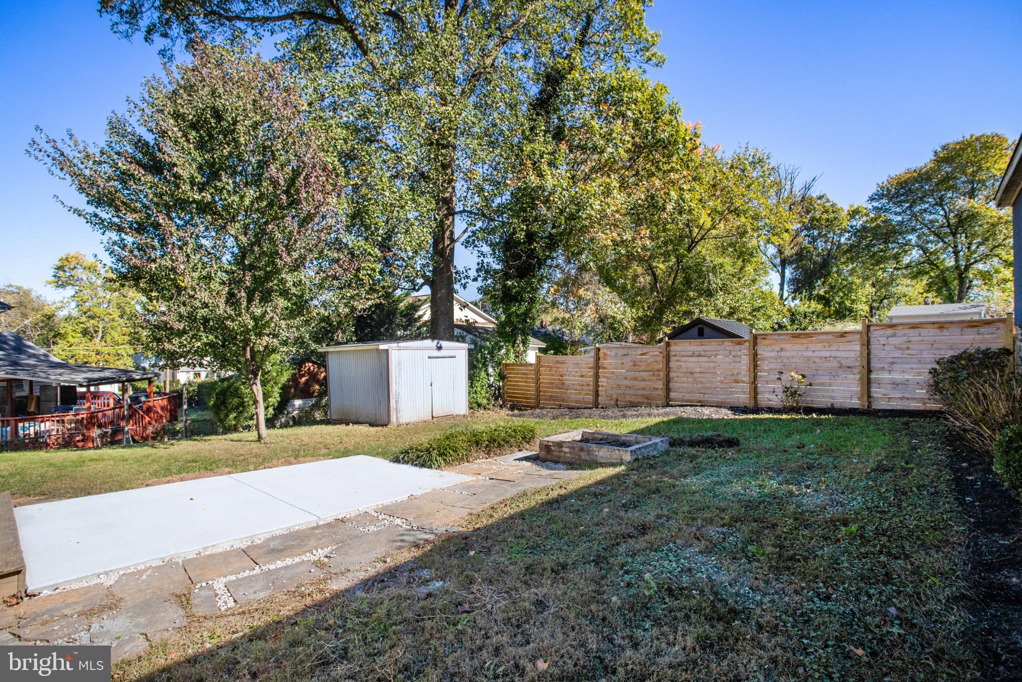 6908 Barrett Road Falls Church, VA 22042 - Photo 5 of 44 Spacious backyard with serene greenery.