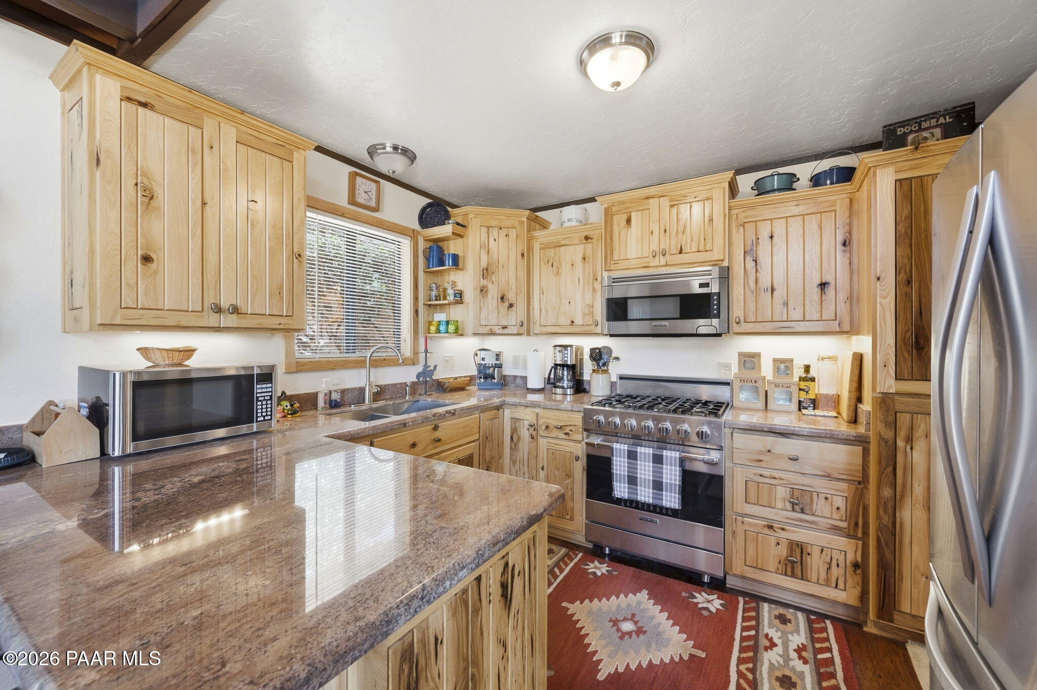 7251 South Big Bug Mesa Road Mayer, AZ 86333 - Photo 18 of 55 a kitchen with stainless steel appliances granite countertop a refrigerator stove and sink